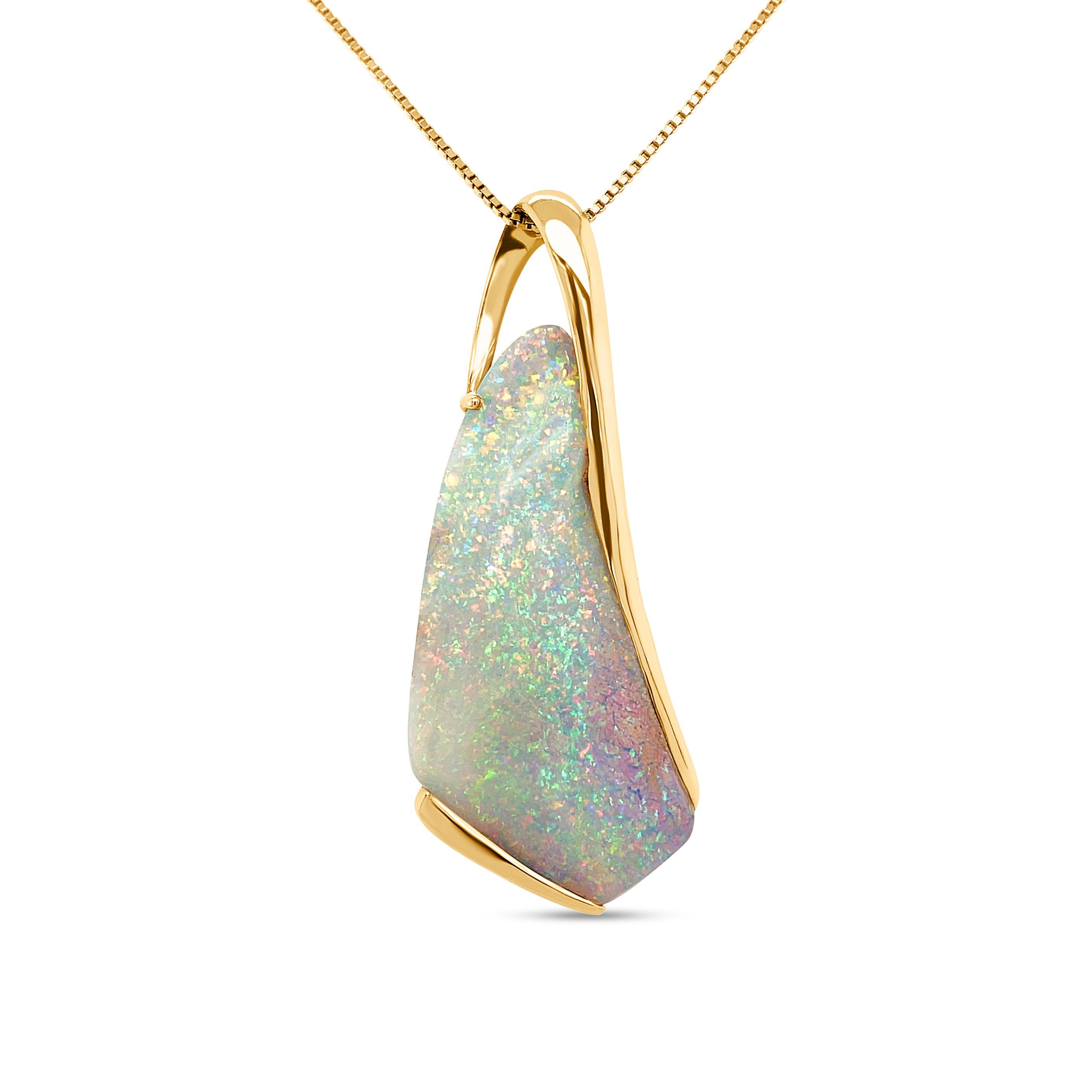 The white-blues and sparkling silvers of wintry dreams swirl in this dreamy boulder opal pendant (32.73ct) skillfully set in 18K yellow gold. The ‘Winter Blossom’ pendant is a divine piece designed to accentuate the grace and ephemeral beauty of the