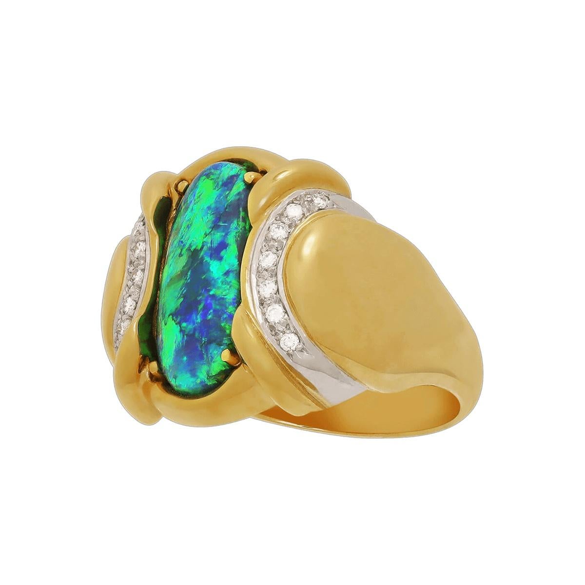 An amazing bright green black opal with a sparkling blue, what a stunning stone. It shows a bright and clean colour from any angle you view. Set in solid 18K gold and platinum, accented with high jewellery grade diamonds, it's a unique and classy