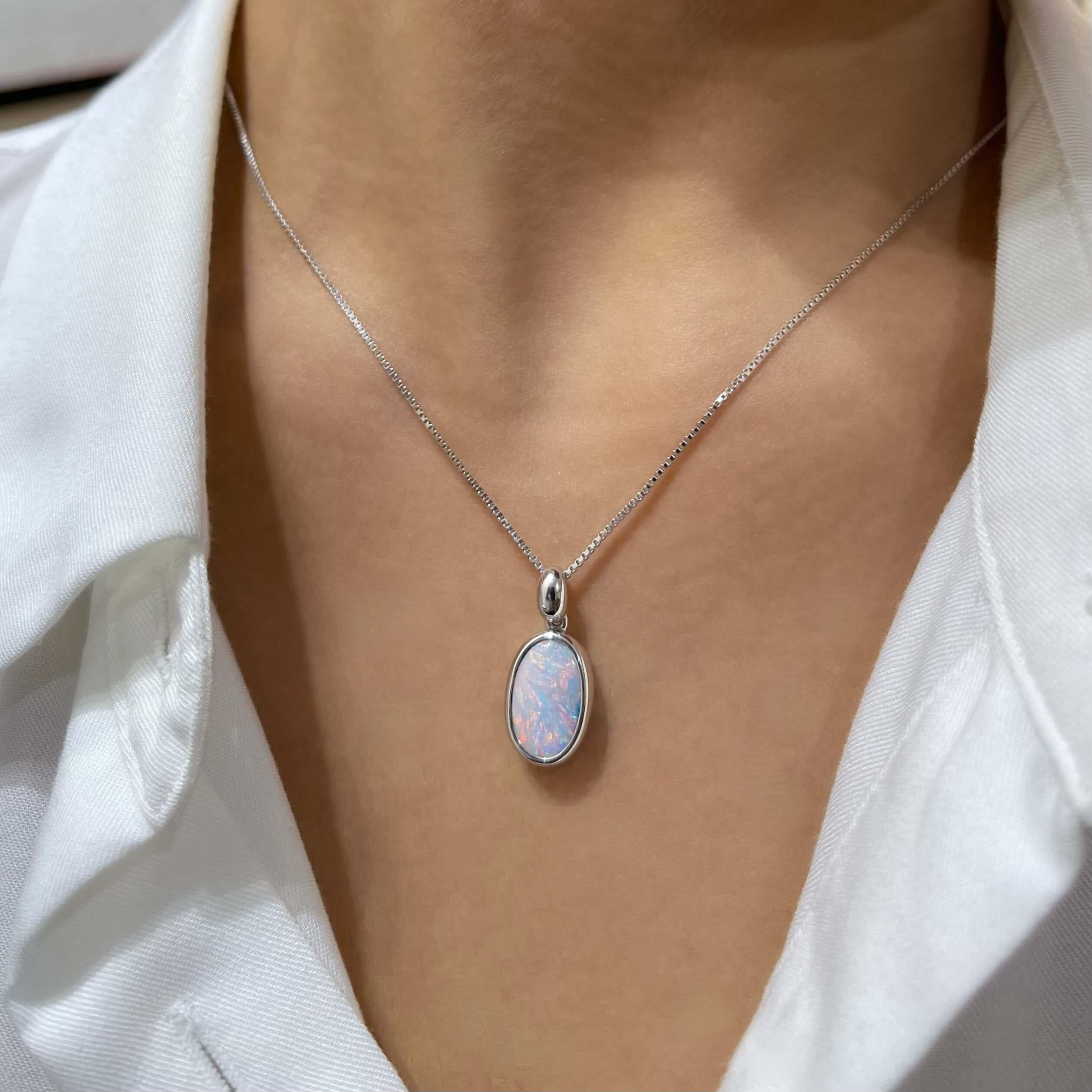 “Margaret” opal pendant features a charismatic boulder opal (3.38ct) ethically sourced from our Jundah-Opalville mines in Queensland, Australia, bound to inspire awe and admiration. Set in our stunning 18K white gold, the intriguing green, pink and