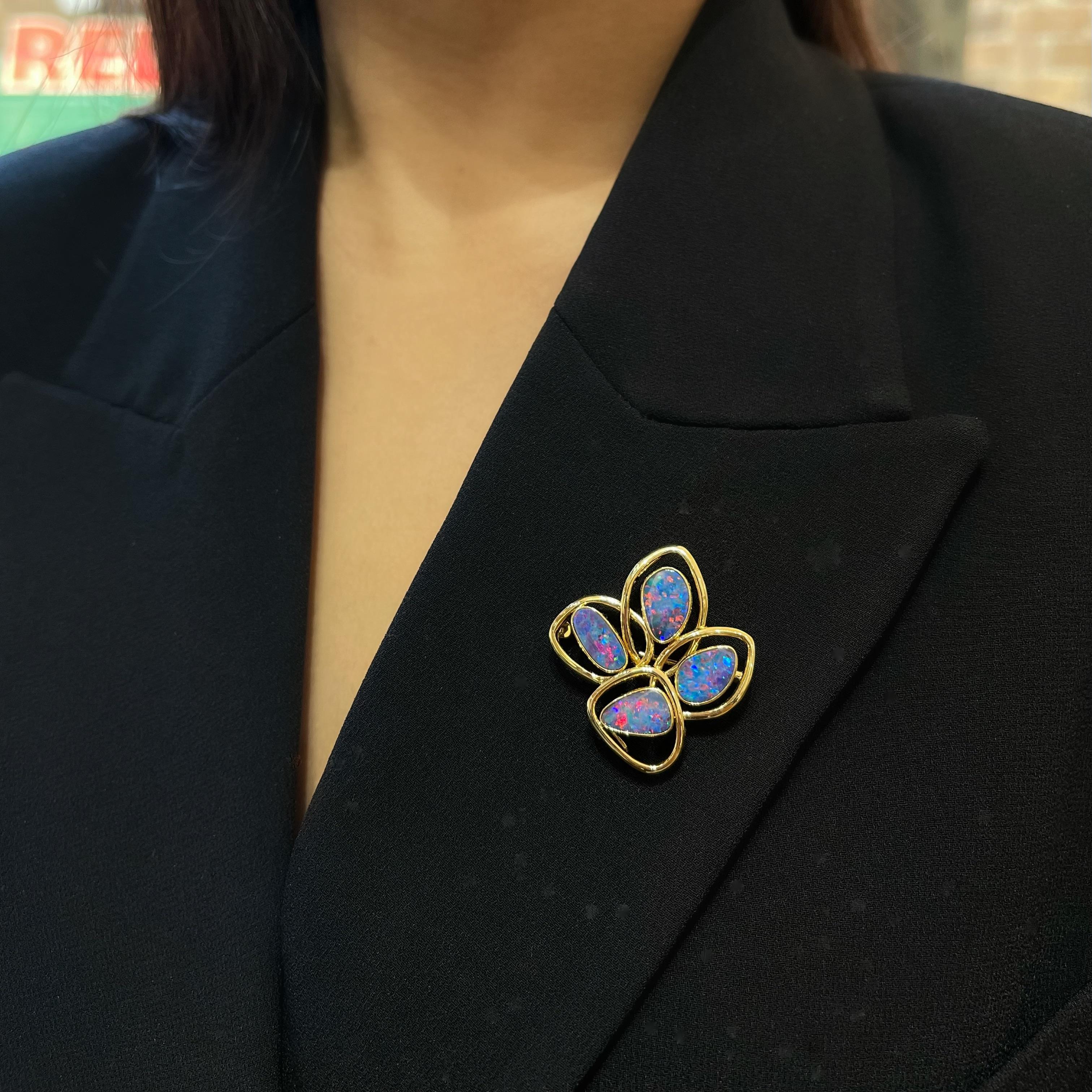 Intricate and opulent, the ‘Florella’ opal doublet brooch (4.29ct) is skillfully set in a beautifully interwoven 18K Yellow Gold lattice. In this piece, the delicate beauty of flower petals is reimagined in the language of fine opal jewelry.