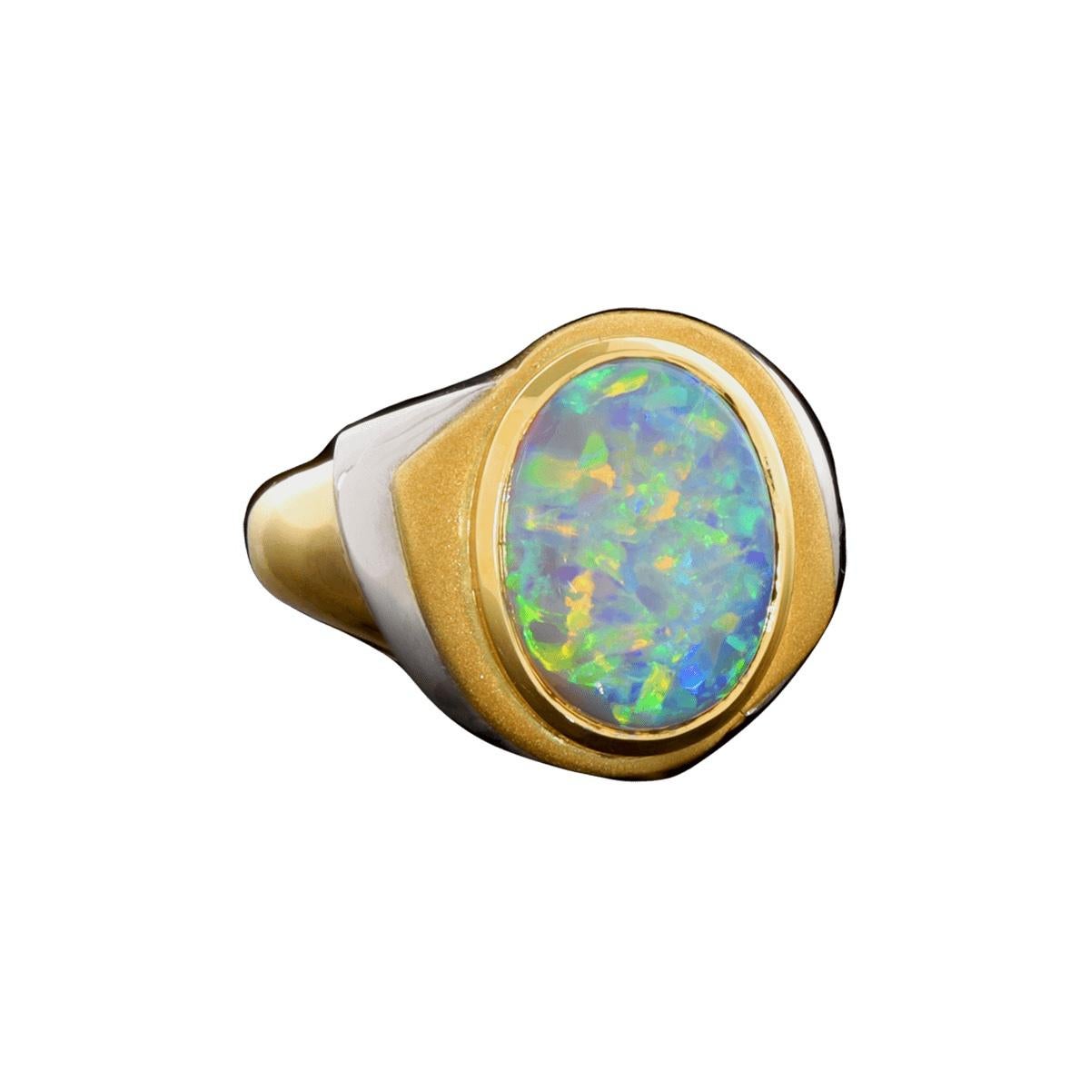 Like a tropical sea, this opal ring sparkles with life. Set in 18K solid gold and platinum, it's a design suitable as everyday wear. The colour play is vibrant and clean with crisp greens and blues and aquas. Don’t forget Australian opal is just as