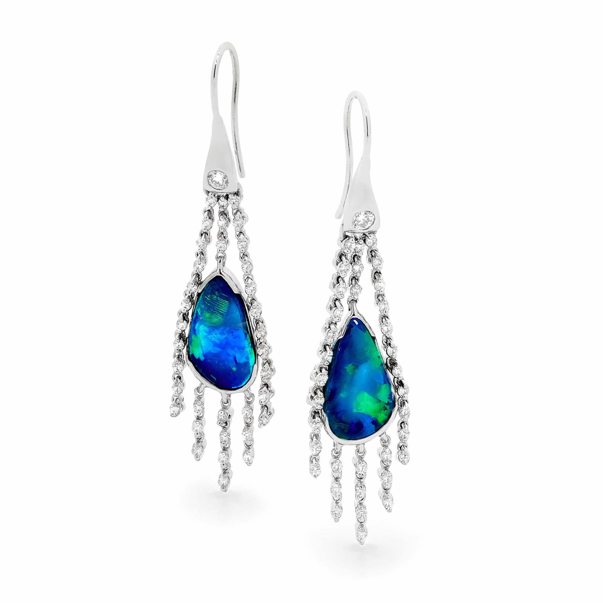 “Starry Nights” superb black opal earrings evoke the beauty of the Australian outback night sky. Black opals (5.25ct) from Lightning Ridge in 18K white gold are awash with diamonds that twinkle like stars and captivate with every movement.