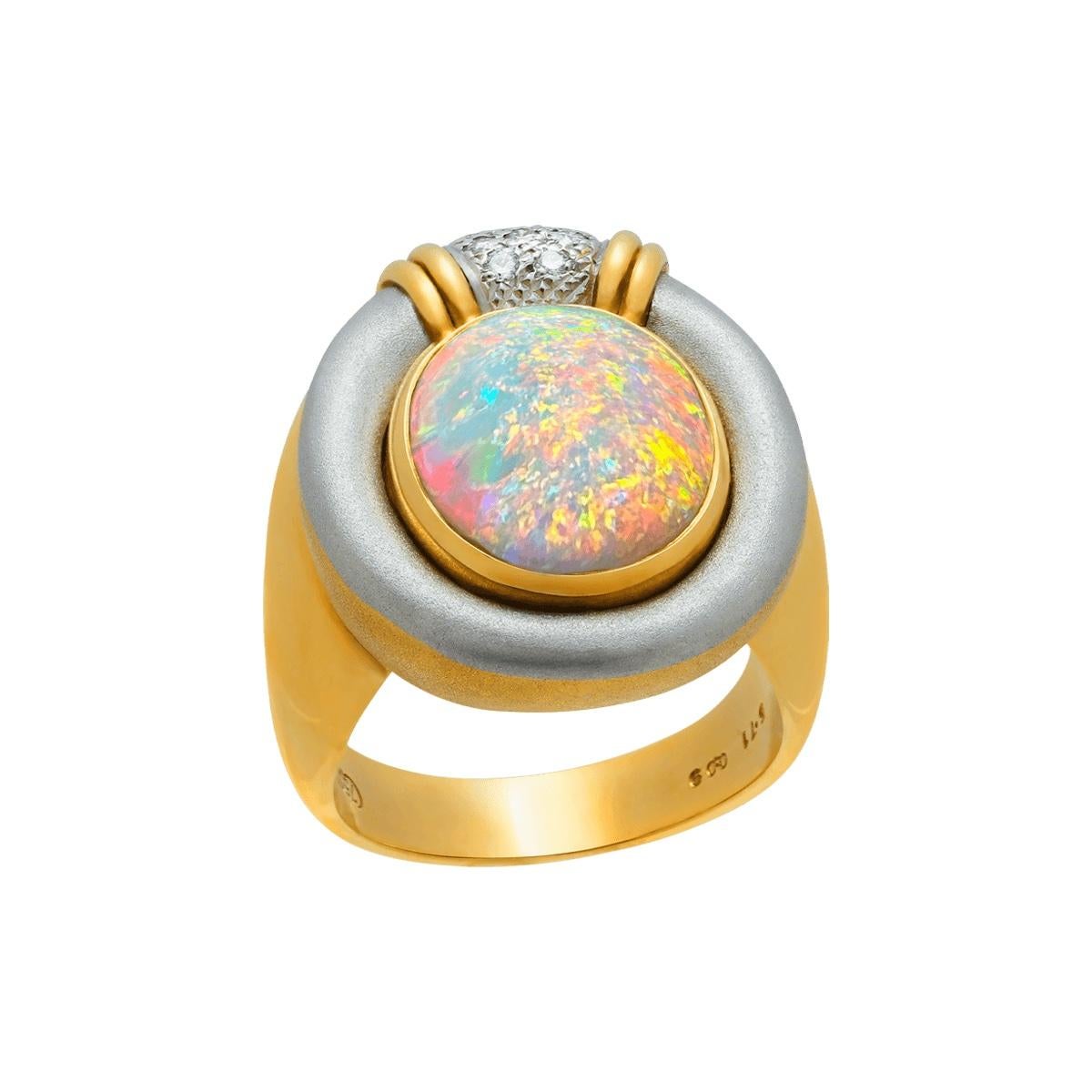 What a beautiful opal this is. A magical stone of oranges and greens, reds and blues, it sparkles brightly from every direction. Some opals have a flat spot of colour known as a window, but not this stone. Even from underneath the ring, it shines.