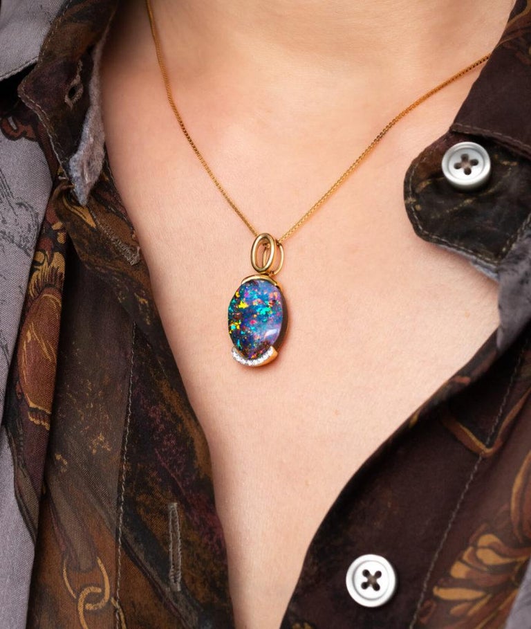 “Let’s Sing” opal pendant is a showstopper. The 8.88 carat boulder opal from Koroit in Queensland dazzles with a kaleidoscope of colours – it’s the bold reds set this gem apart. Cradled by delicate diamonds and set in 18K yellow gold, “Let’s Sing”