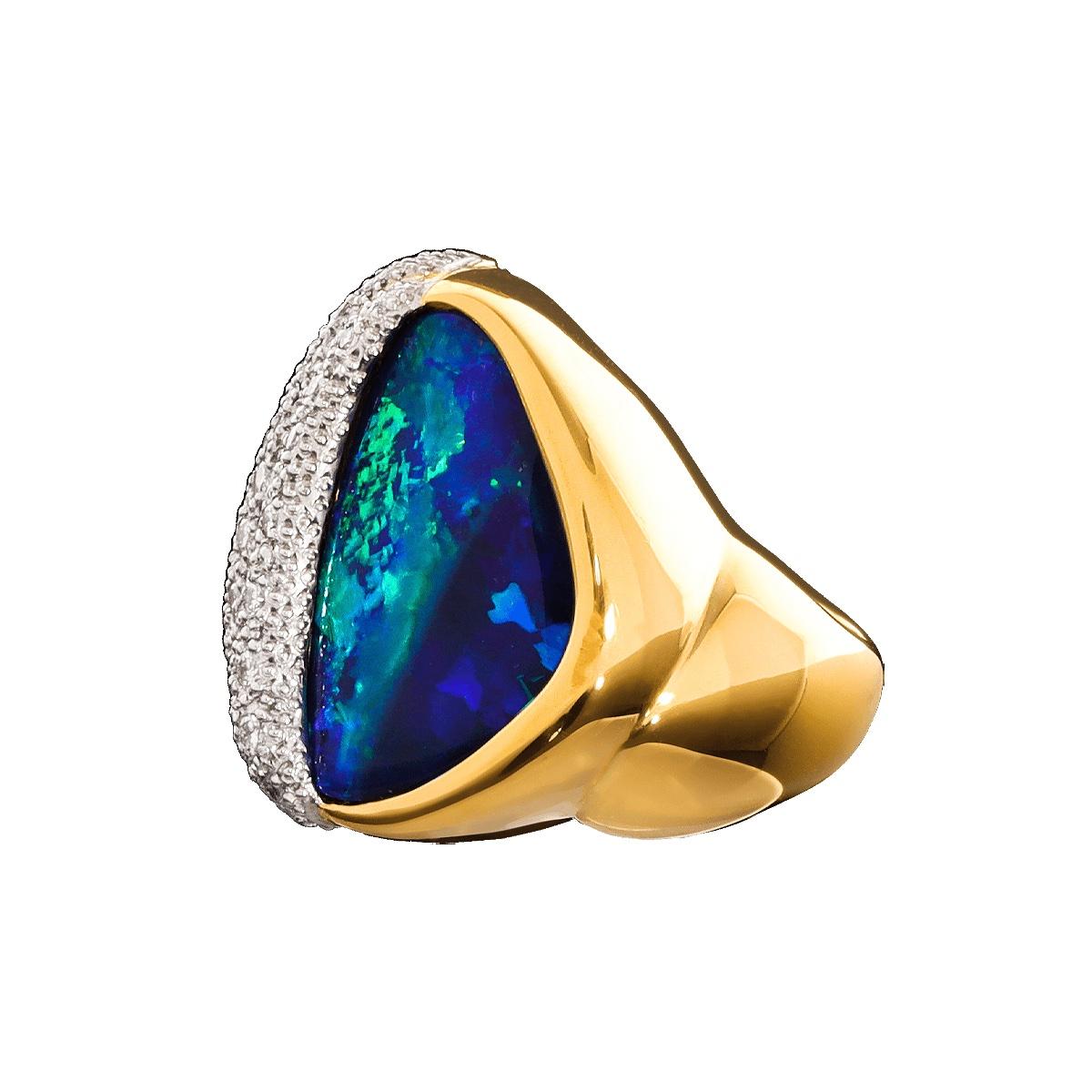 In a class of its own with a style from the roaring ’40s, this beautiful cocktail rings has it all. A stunning multi-patterned Black Boulder Opal, encrusted pavé set brilliant white diamonds, 18K solid gold and platinum 950. Every woman should own a