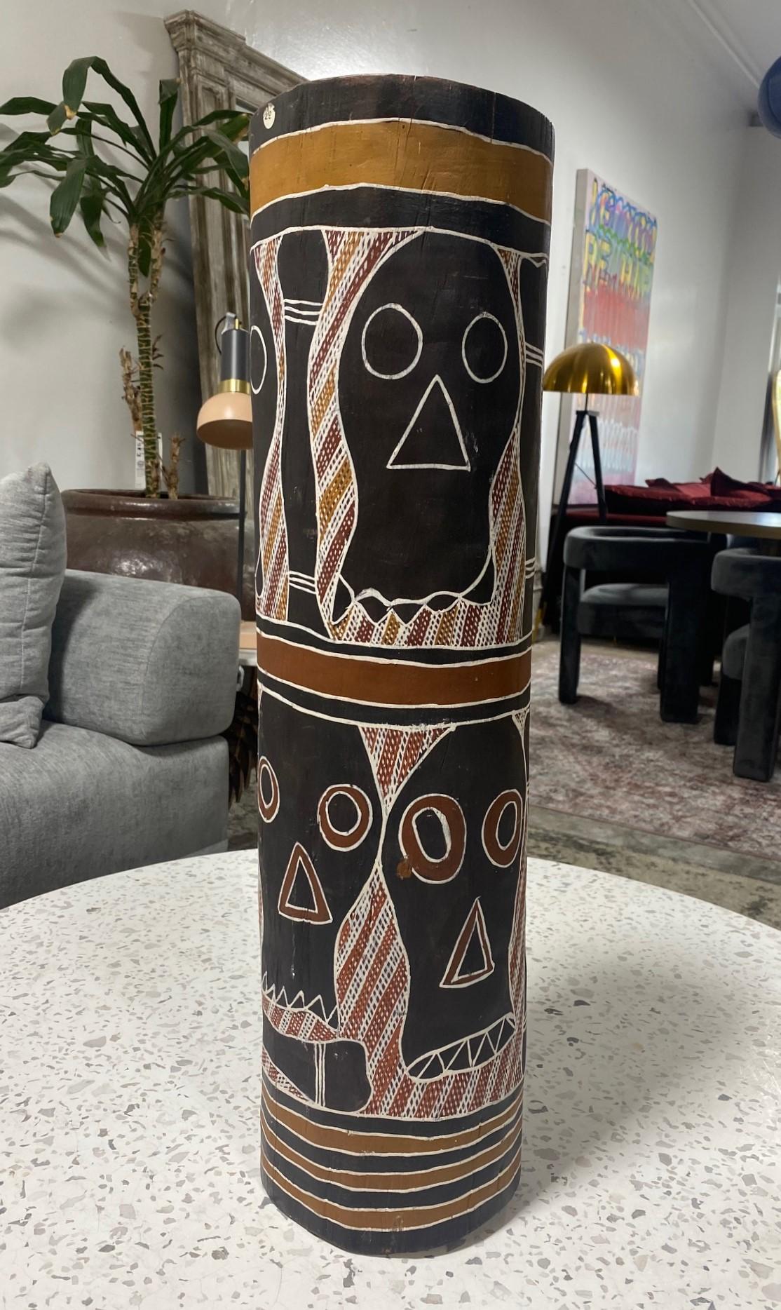 A wonderful and quite engaging hand carved wood with hand painted ochres on a hollow wooden log coffin with skull and bone designs. 

This piece is from the famed Kelton Collection of important Australian Indigenous Works of Art and is attributed