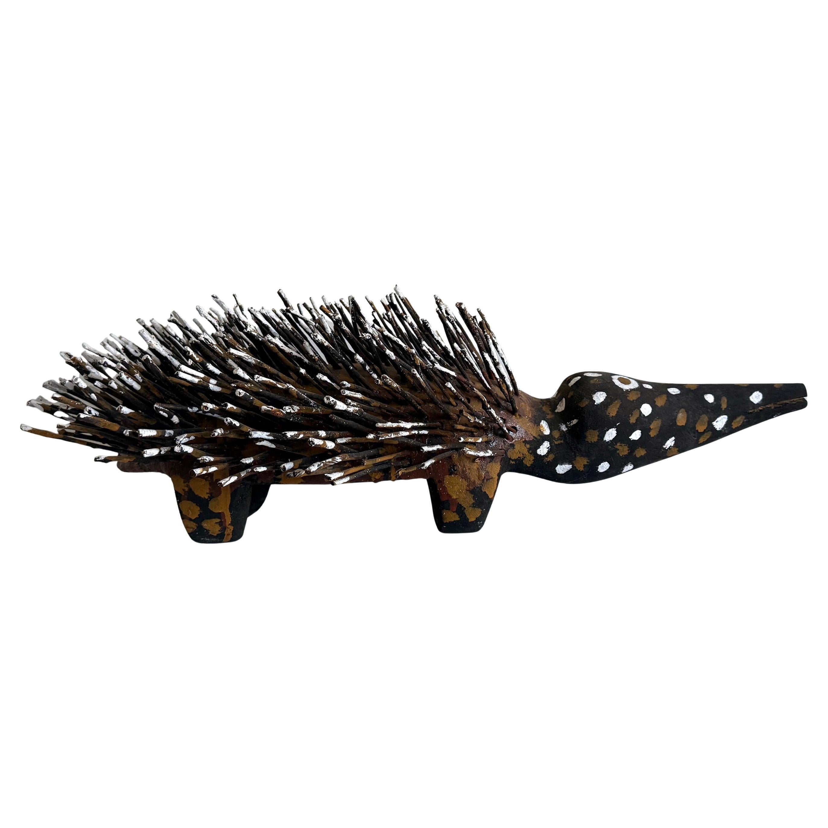 Australian Aboriginal Wood Sculpture with Ochre Echidna Bob Burruwal For Sale