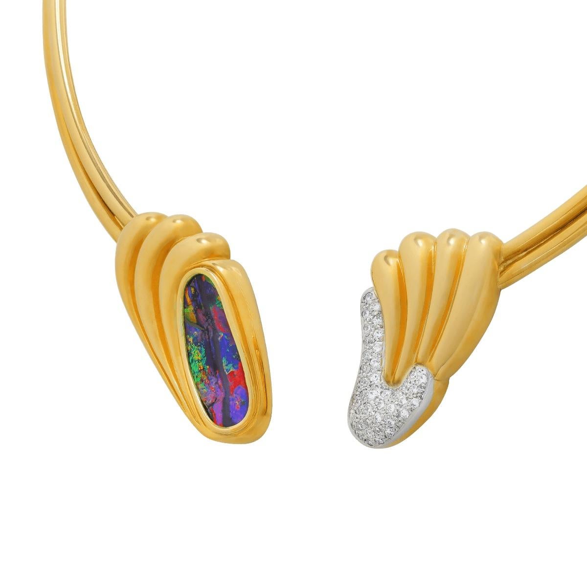 The rich, bright colours of this unbelievable black boulder opal are without compare. The purples and reds, greens and pinks, it has every desired colour, and they are vivid. Set in a unique collier of 18K solid gold and high jewellery grade