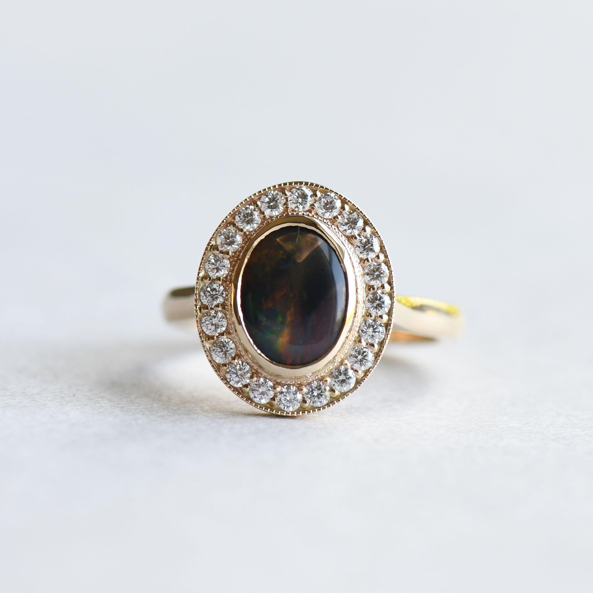 For Sale:  Australian Black Opal 1.188 Carat Ring, 14 Karat Gold Halo Ring 3