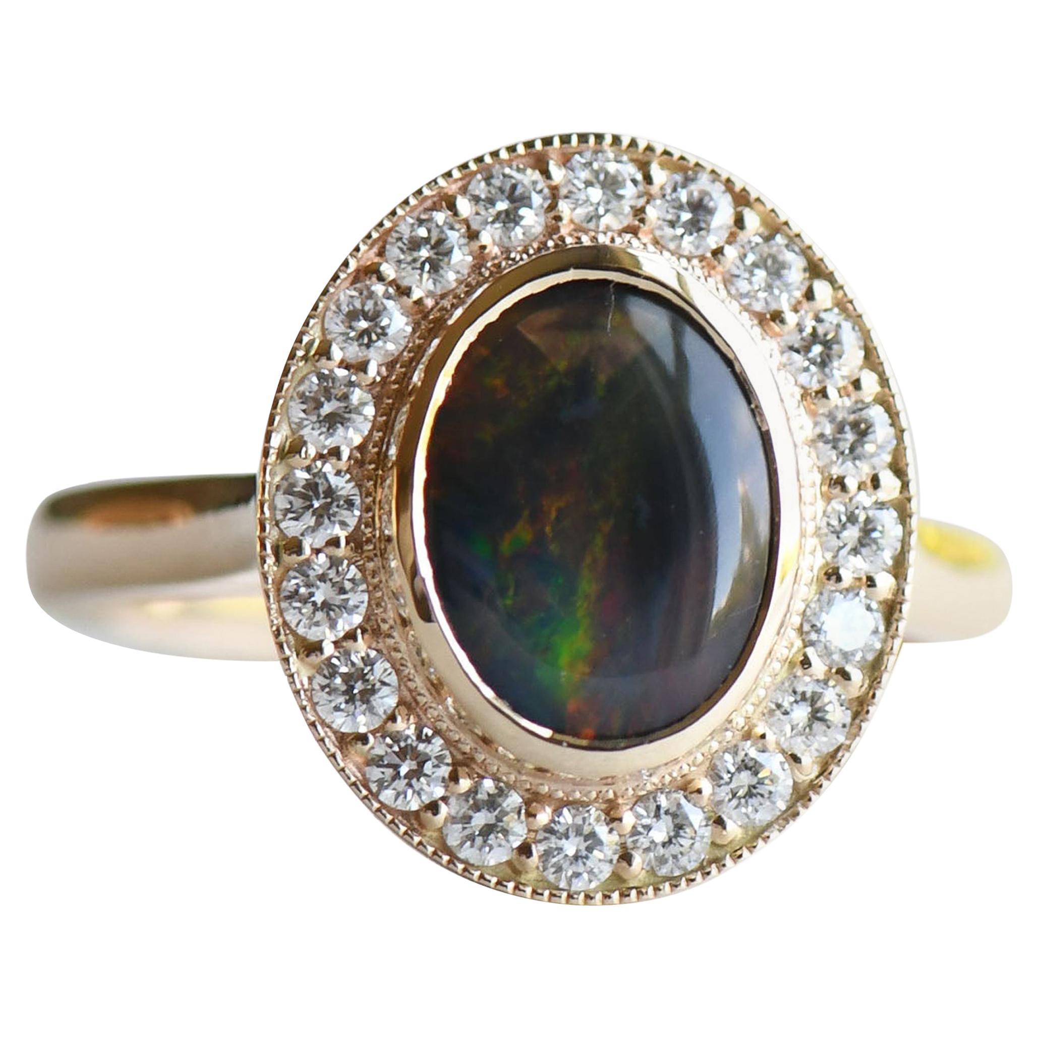 For Sale:  Australian Black Opal 1.188 Carat Ring, 14 Karat Gold Halo Ring