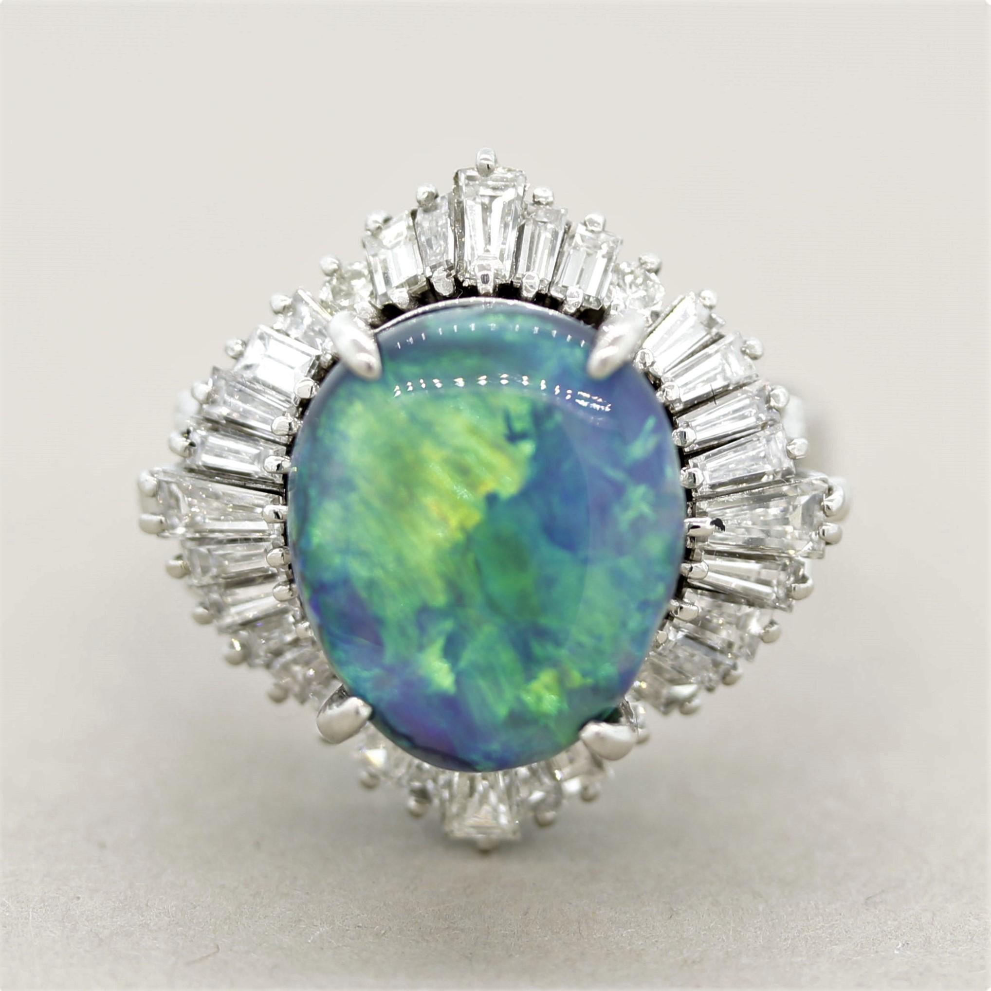 A large and impressive ring featuring a natural black opal from Australia! It weighs 4.42 carats and has excellent play-of-color as large and bright flashes of blue and green can be seen across the stone. It is accented by 1.59 carats of