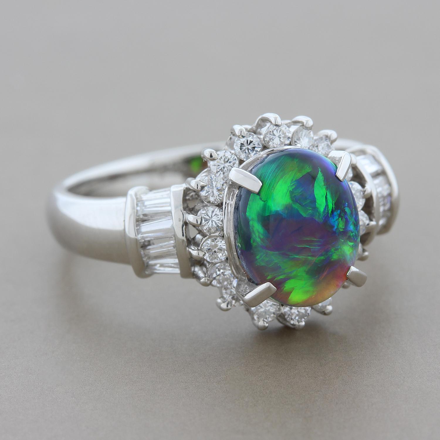A captivating 1.26 carat Australian black opal with intense play of color showing big flashes of blue and green. The opal is haloed by round cut diamonds and baguette cut diamonds set in the shoulders of the platinum ring, totaling 0.46