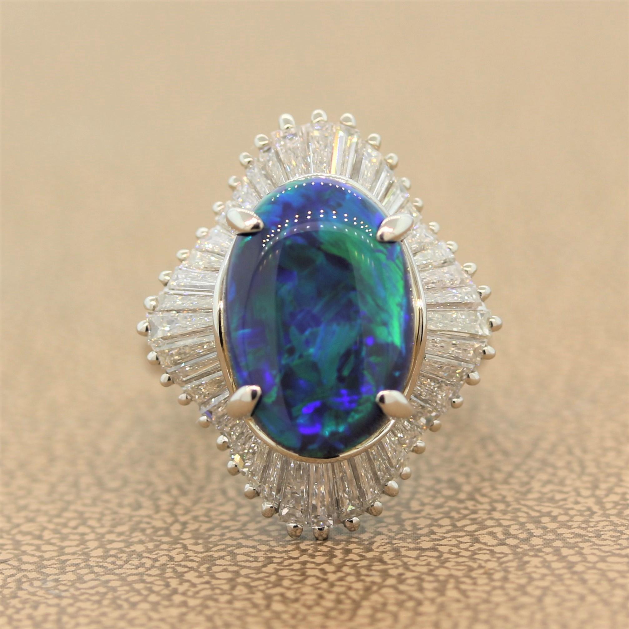 A perfect cocktail ring for day and night featuring a gem 4.83 carat black opal. The Australian opal shows bright and strong flashes or blue and green over a deep dark black body color enhancing the play of color from the opal. It is haloed by 2.25