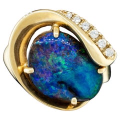 Australian Black Opal Ring with Diamond Accents mounted in 14 Karat Yellow Gold
