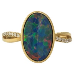 Australian Black Opal Ring with Diamonds made of 14 karat Yellow Gold