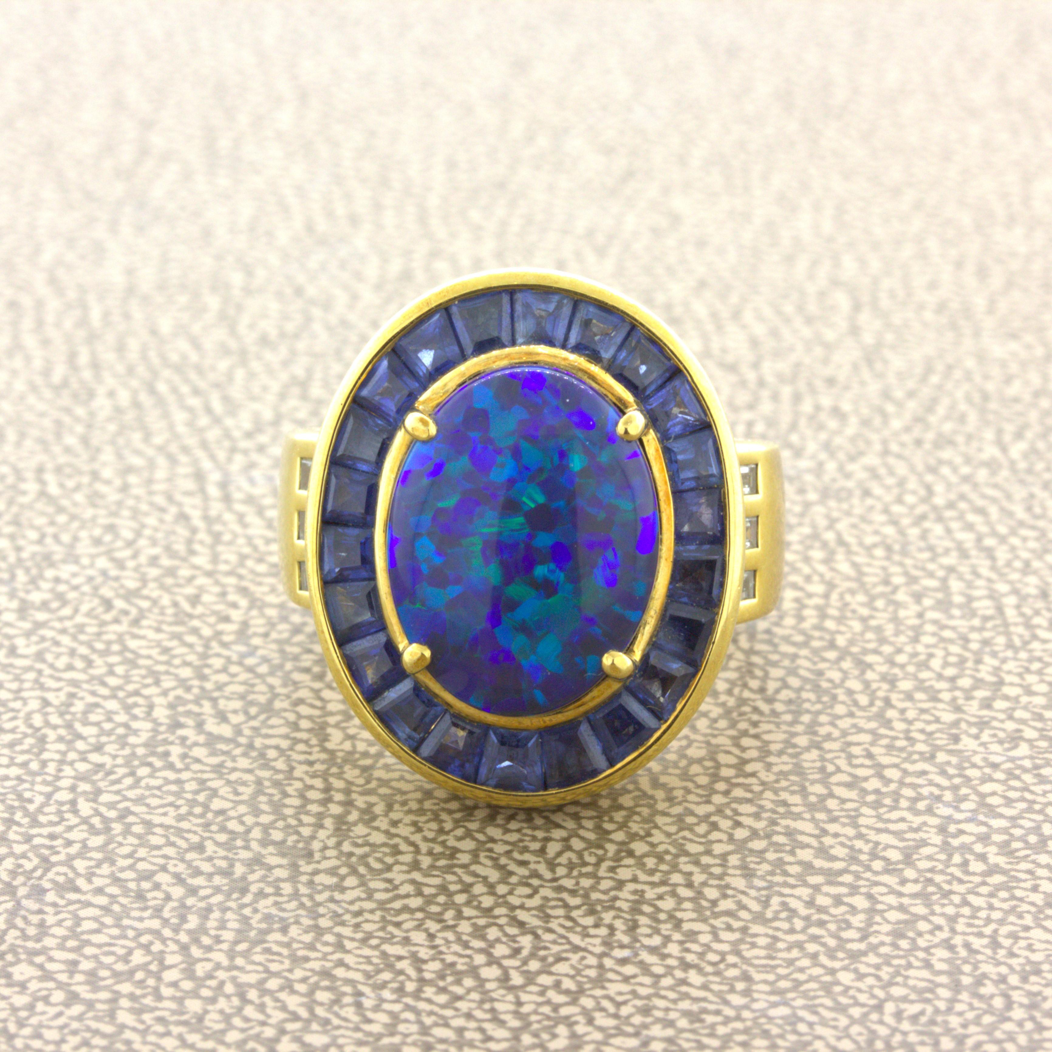 A lovely natural black Australian opal set in the middle of a unique yellow gold ring. The opal weighs 6.87 carats and has a classic blue-green play-of-color. There are various shades of blue and green which flash brightly across the black body