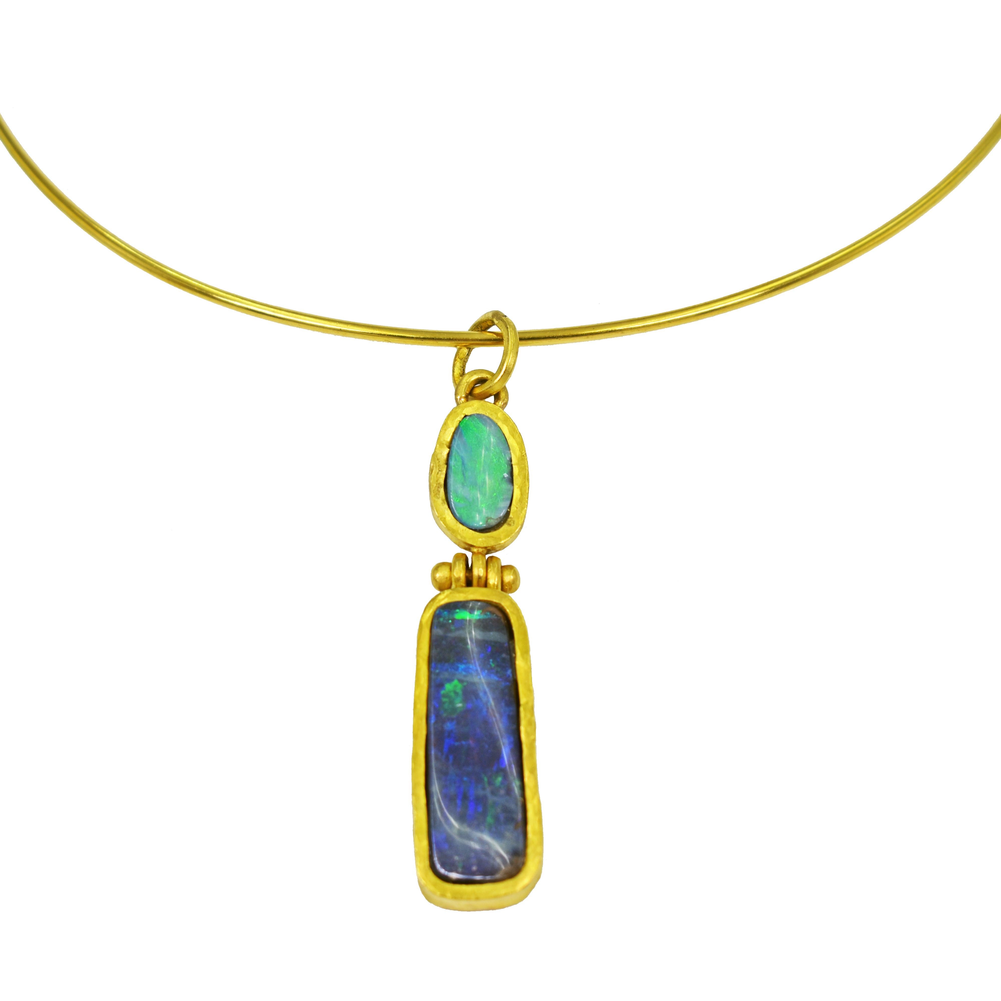 Australian Boulder Opal and hammered 22k yellow gold hinged pendant on 22k wire collar necklace. Neck wire is 15 inches in length. Pendant, including bail, is 2.32 inches in length. Back of pendant is signed 22k and VO. Gorgeous green / blue Opals