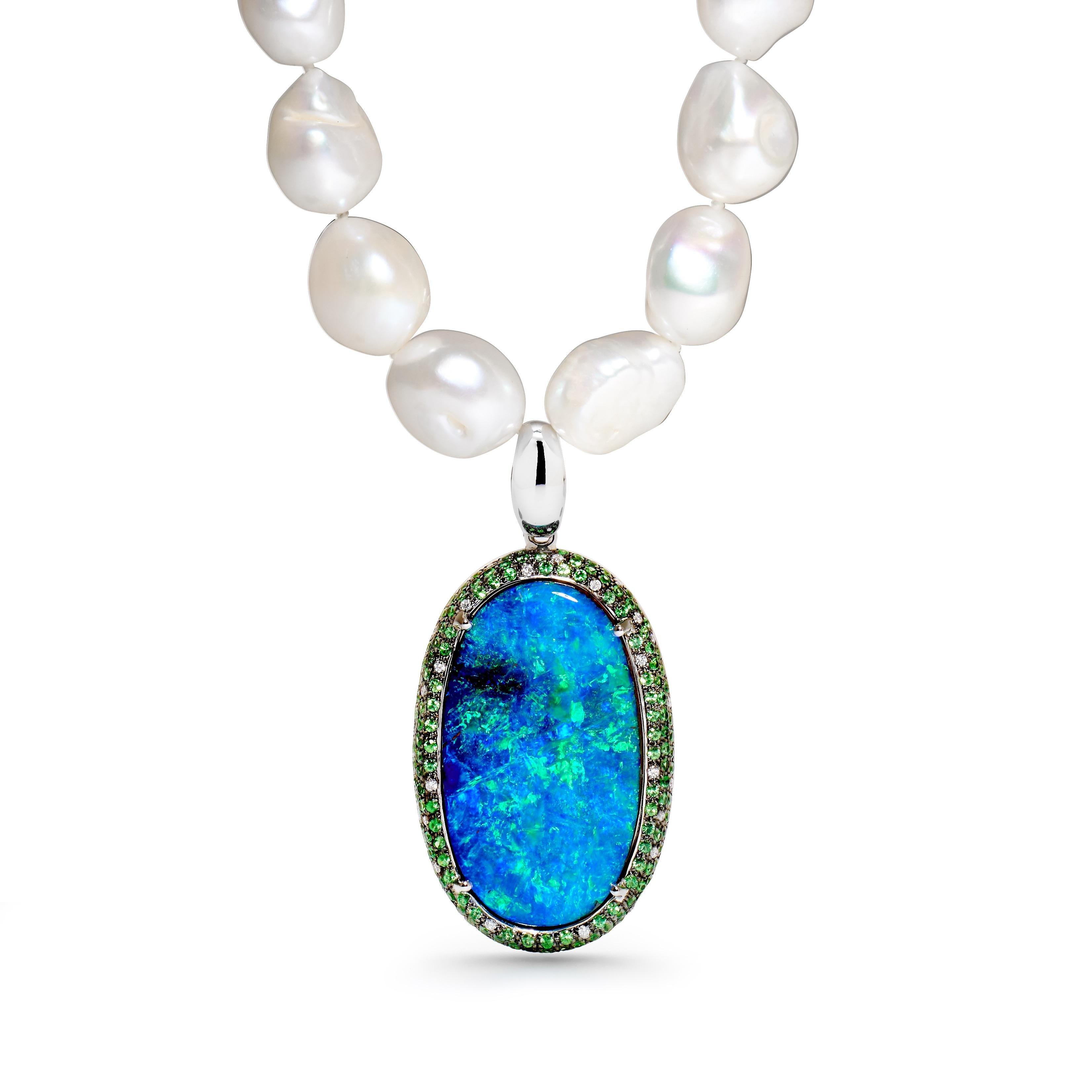 “Amor Para Siempre” opal pendant will make you fall in love. A breathtaking 49.85 carat boulder opal from Winton is set in 18K white gold and complemented by sparkling diamonds and tsavorites. Guaranteed to turn heads, this piece is the