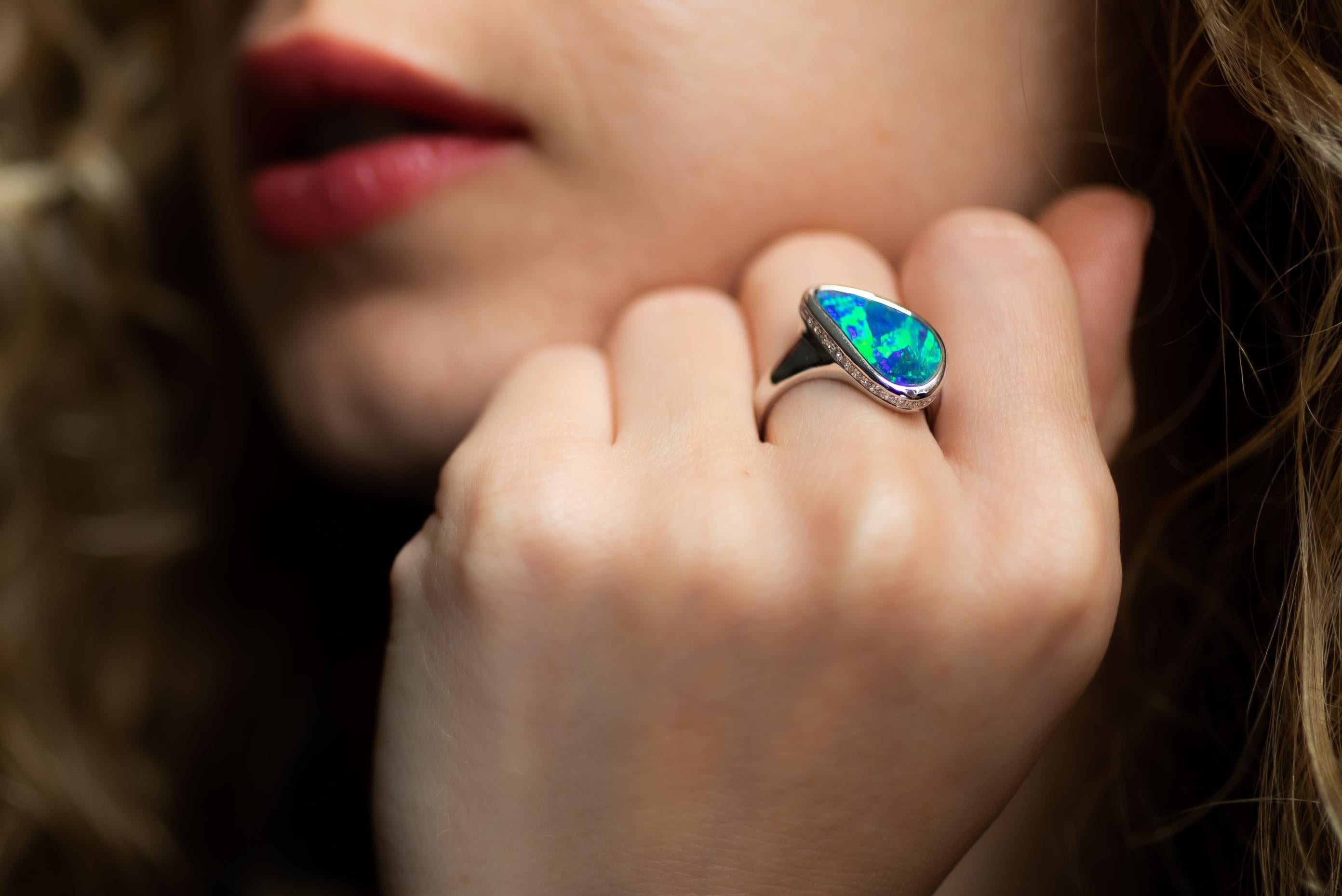 Spectacular 4.80ct Australian national gem comes from mines in Winton. Natural boulder opal shows off vibrant greens and blues that will surprise you forever. Complimented by 37 sparkling diamonds, set in the 18K white bed. Kakadu is waiting for