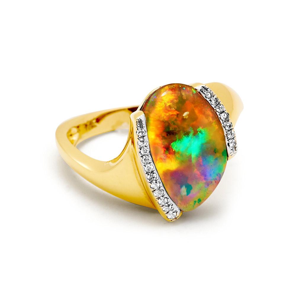 “Desert Flame” opal ring presents a peerless 4.48 carat boulder opal from our own mines in Jundah-Opalville. Crafted in 18K yellow gold and flanked by twinkling diamonds, the opal mesmerises with its electrifying colour palette. A piece that will