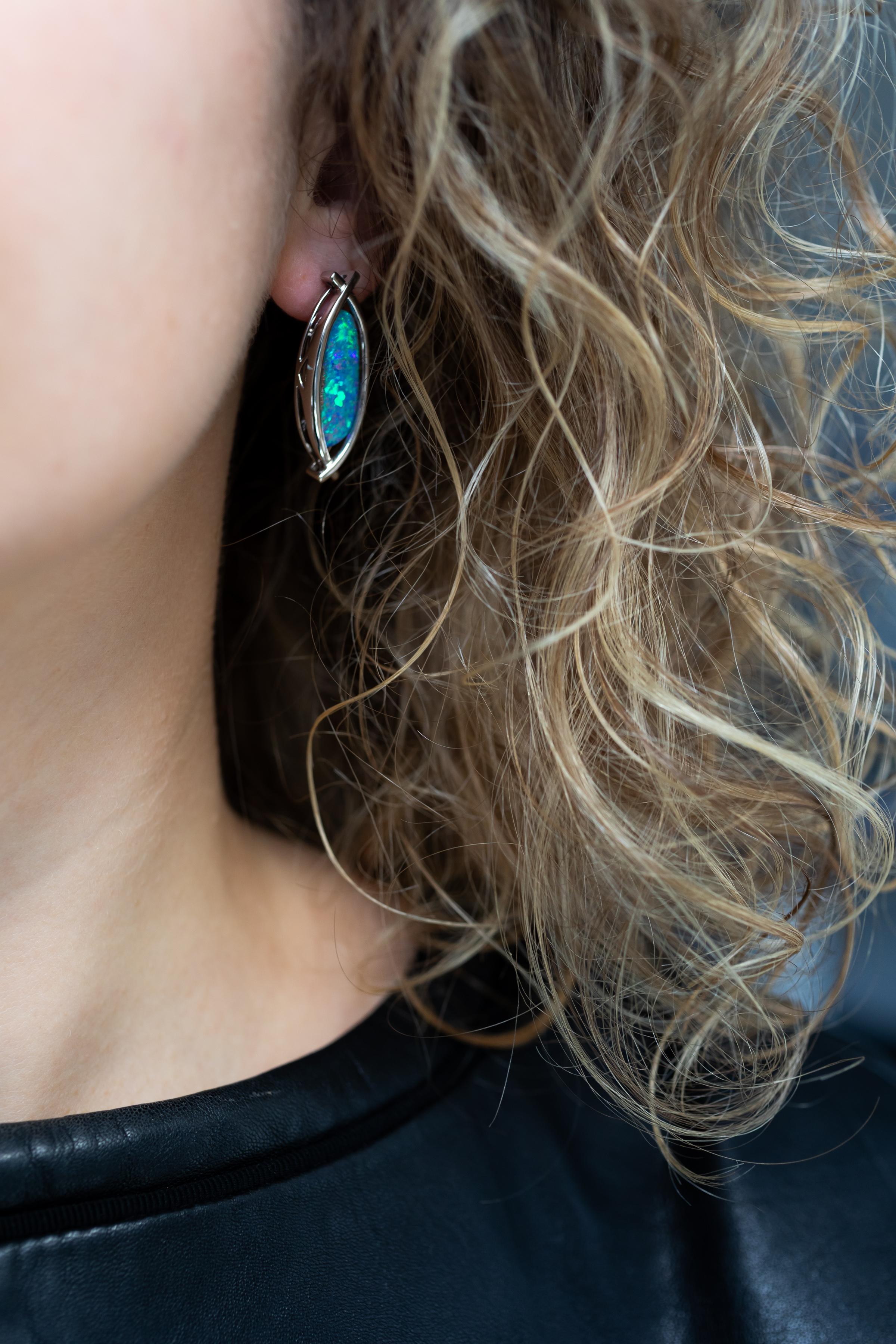 “Sunnfjord” opal earrings celebrate Norway’s majestic fjords. Bright as a Norwegian seascape, boulder opal twins (10.87ct) are set in glacial 18K waves of white gold. This perfectly matched pair hail from our own mine in Jundah-Opalville. Designed