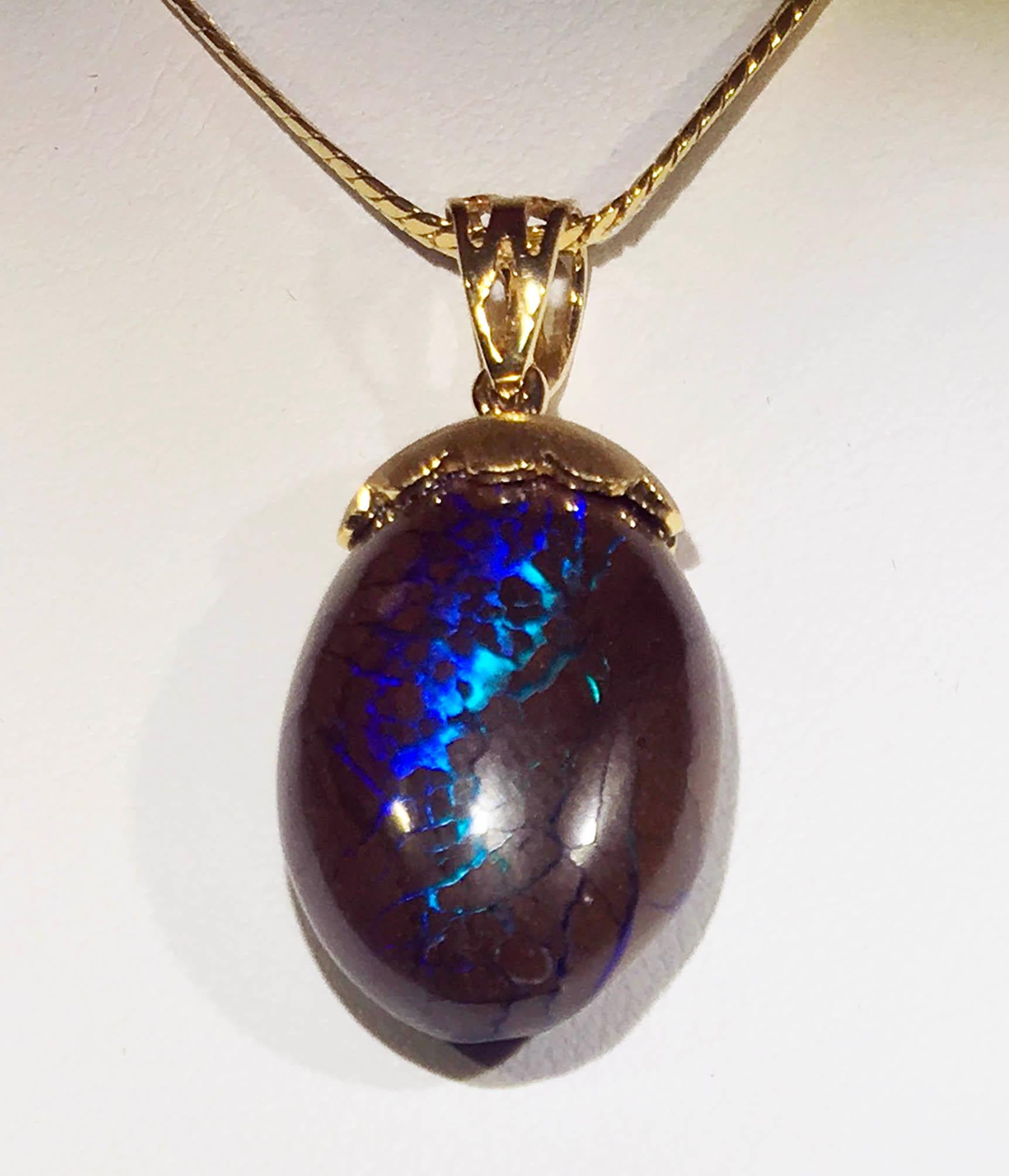 Australian Boulder Opal Pendant Hanging from a 23kt Gold Necklace 2