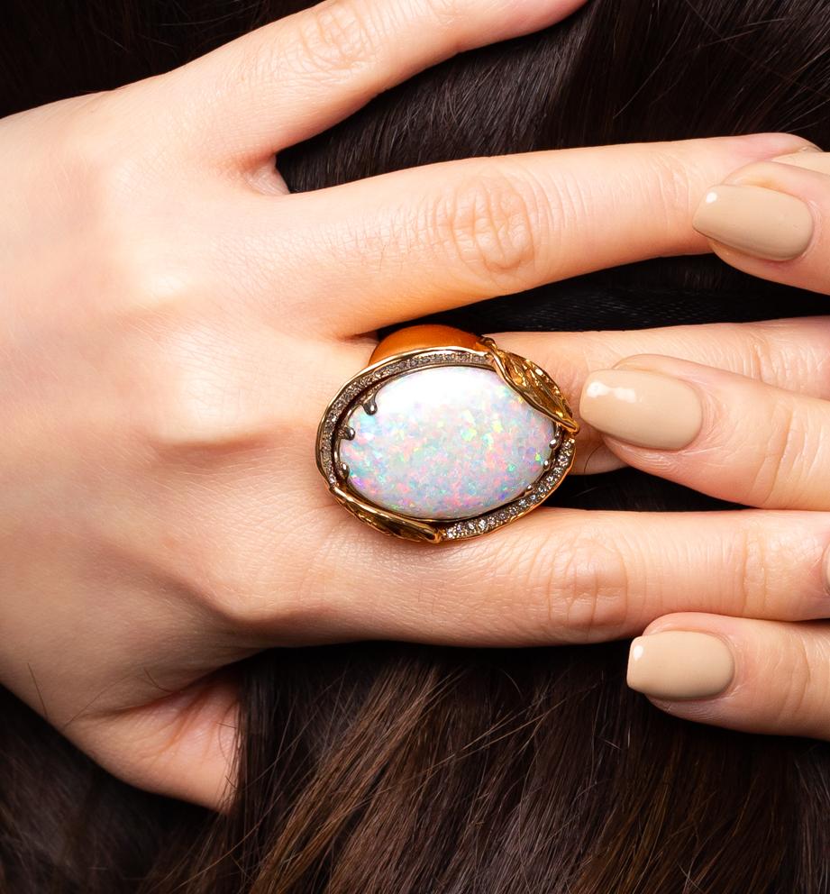 “Love in White” opal ring is a celebration of unconditional love. The precious boulder opal (27.56ct) from our mines in Jundah-Opalville is set in a distinctive 18K yellow gold setting and adorned with a swathe of diamonds. Handcrafted perfection.