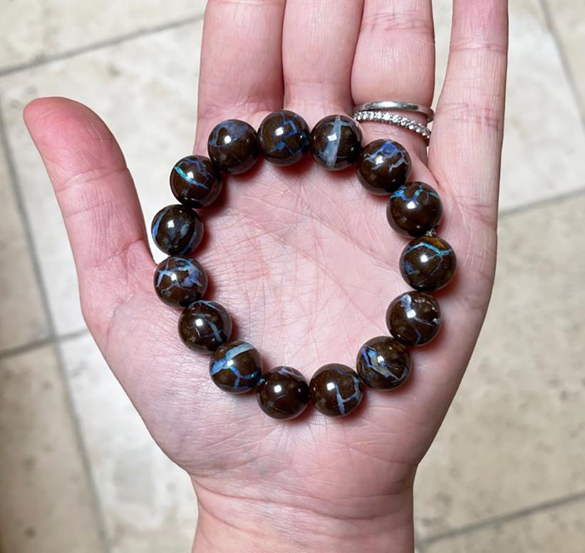 Dazzling natural Australian Boulder opal stretch bracelet made with natural round boulder opal beads (approximately 13-14mm). Handcrafted in the USA by Rocat Designs. The Boulder opal beads are stunning with vivid color - every bead has flashes of