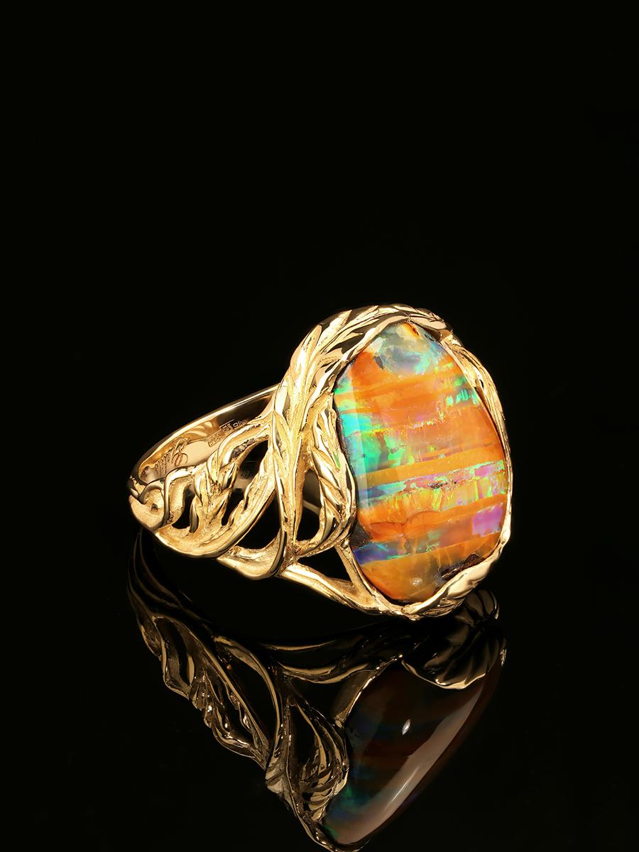 Art Nouveau style ring with amazing boulder opal in 14k yellow gold
opal origin - Australia 
opal measurements - 0.2 х 0.47 х 0.63 in / 5 х 12 х 16 mm
stone weight - 8.70 carats
ring weight - 6.12 grams
ring size - 7.5 US


We ship our jewelry