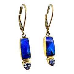 Australian boulder opals paired with pear-cut tanzanites,  18-karat yellow gold