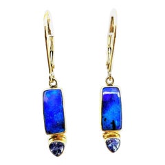 Australian boulder opals paired with pear-cut tanzanites,  18-karat yellow gold