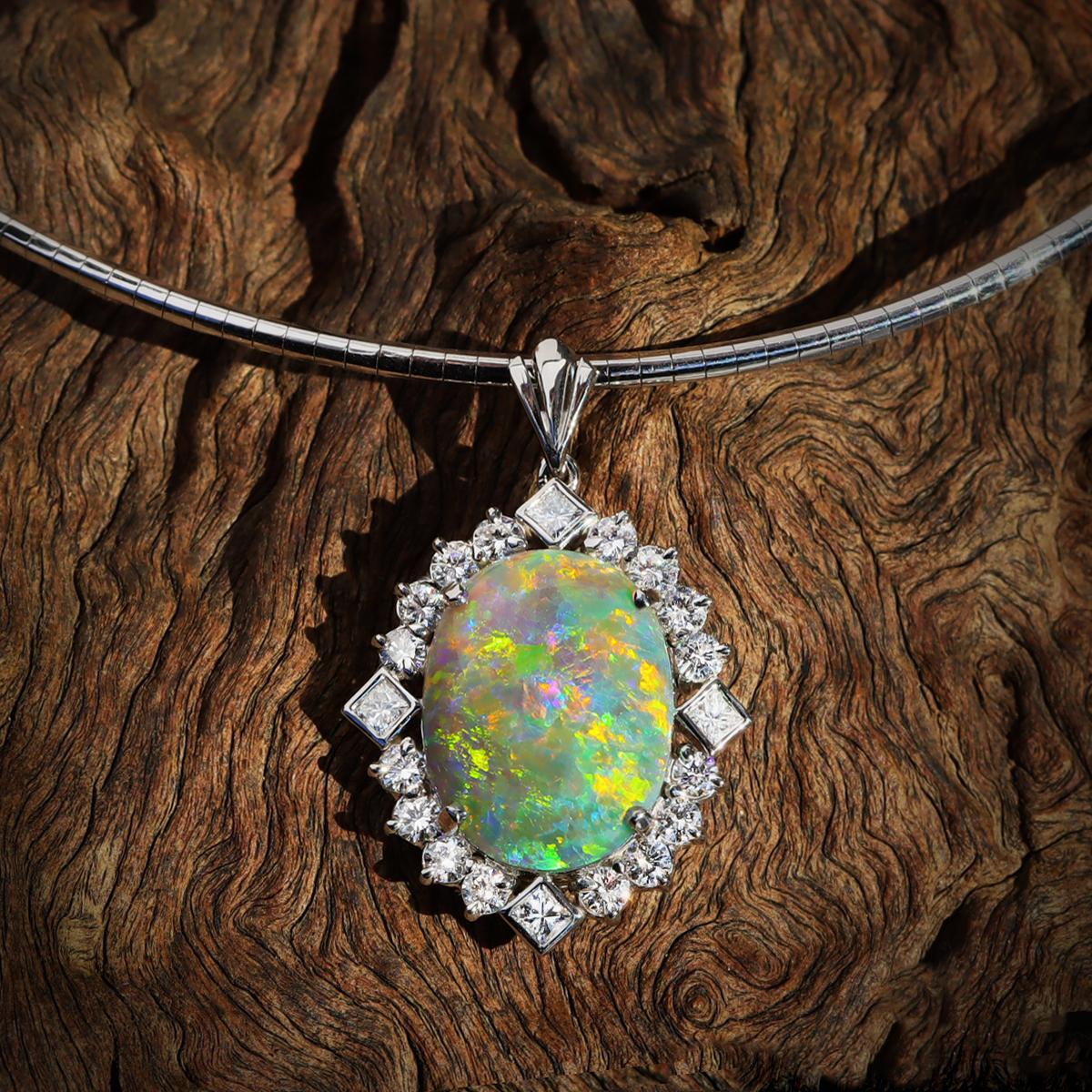 An amazing opal fit for a princess. Its depths seem endless and the colours are just astonishing. Set in solid platinum and surrounded by 16 round, high jewellery grade brilliant white diamonds and 4, high jewellery grade white princess cut
