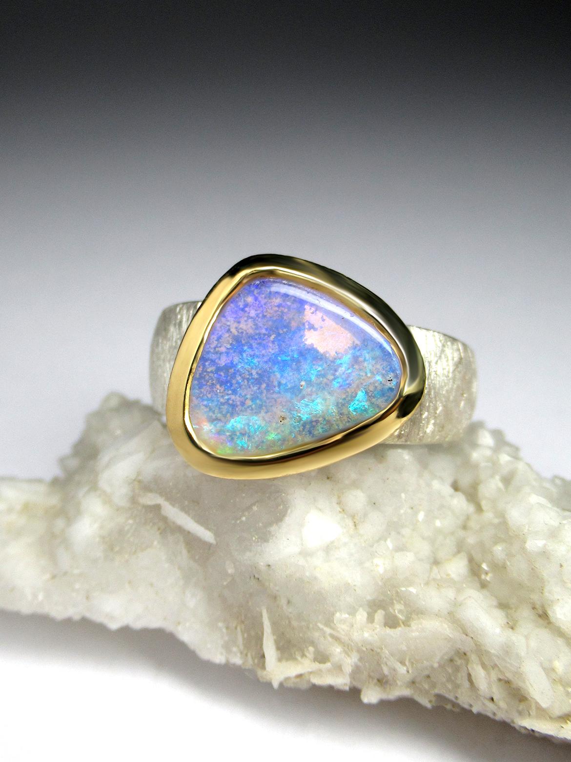 Silver and 18K gold plated ring with natural Neon crystal Opal 
Opal gemstone origin - Australia 
opal measurements  - 0.39 x 0.47 in / 10 х 12 mm
ring weight - 7.2 grams
ring size - 7 1/4 US 
ref No 2451

Worldwide shipping from Berlin, Germany.