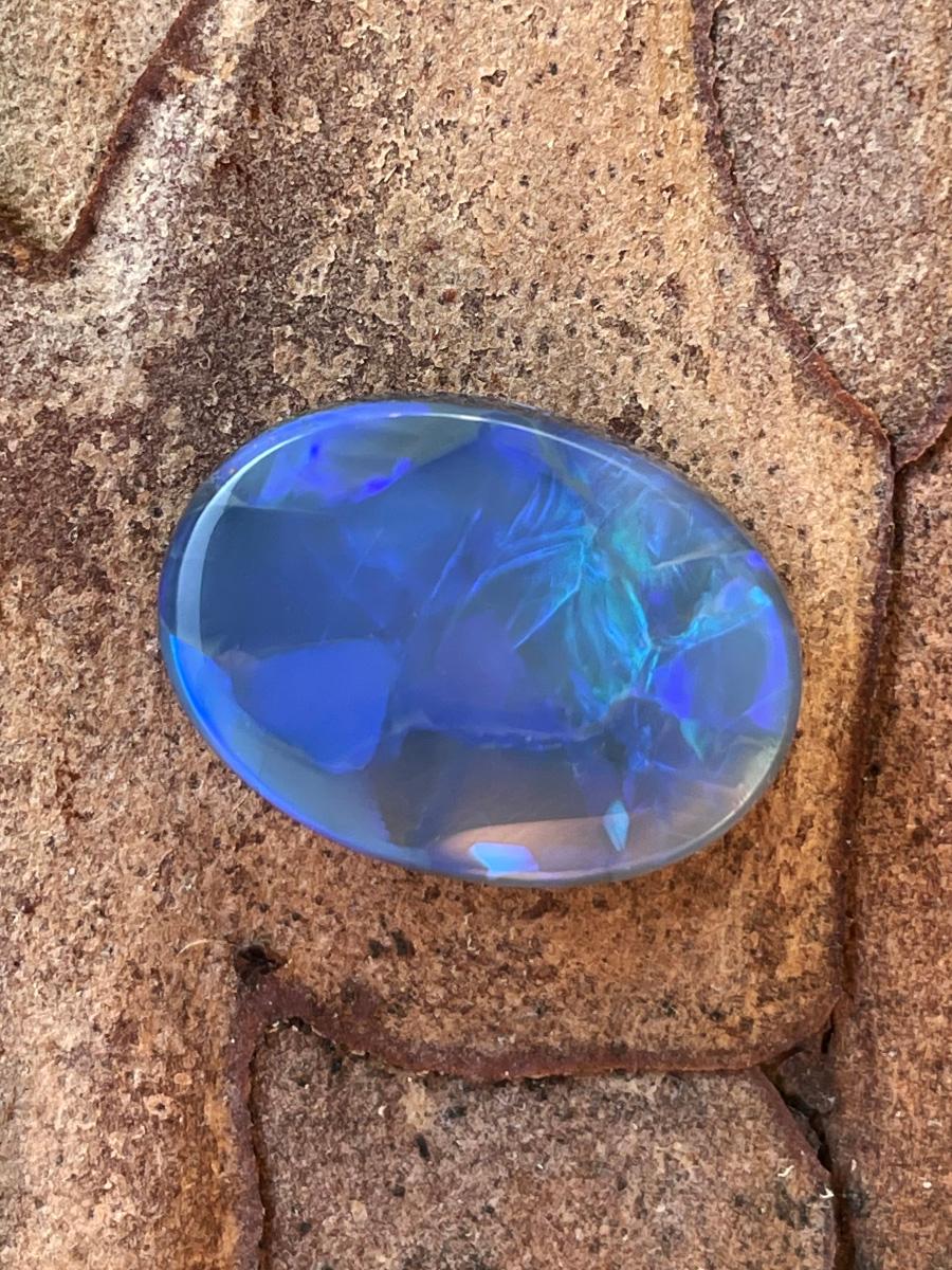 Natural dark opal cabochon with bright blue and green opalescence

opal origin - Australia

stone measurements - 0.2 х 0.55 х 0.75 in / 5 х 14 х 19 mm

stone weight - 9.70 carats