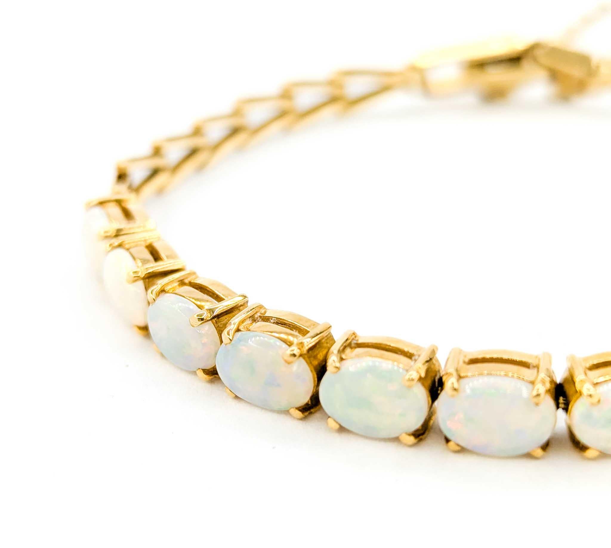 Australisches Armband aus 18 Karat Gold mit geflammtem Opal-Cabochon Damen