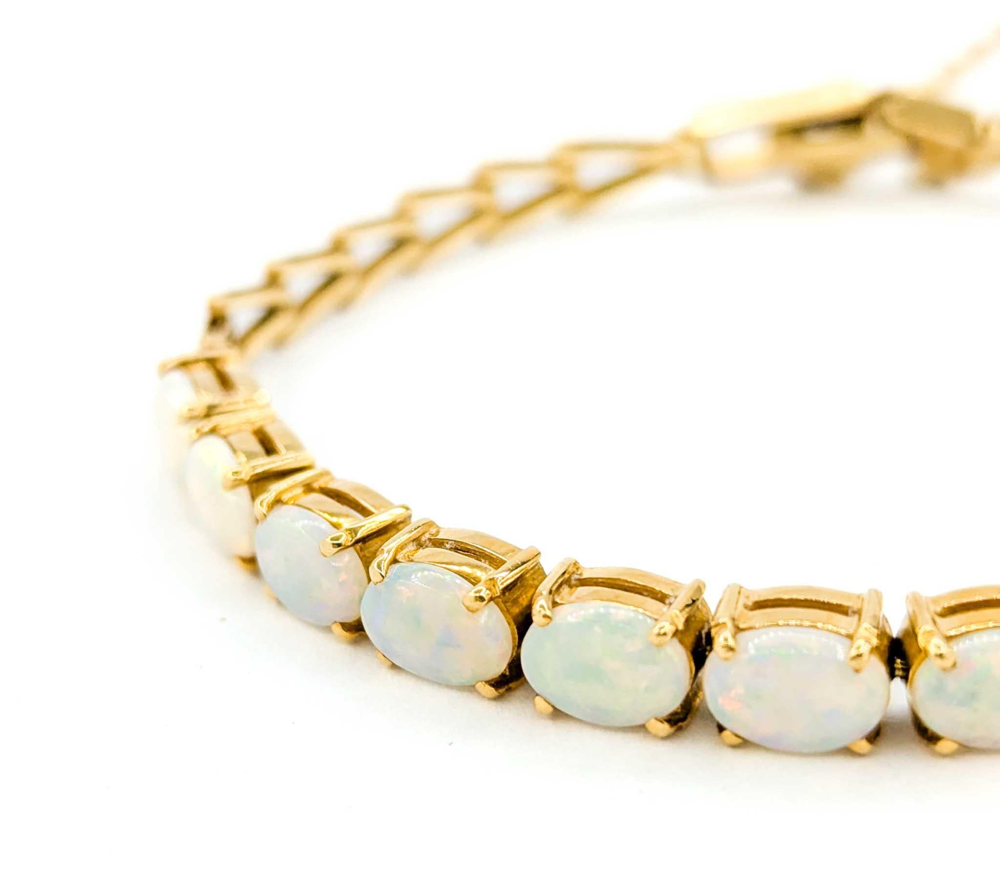 Australisches Armband aus 18 Karat Gold mit geflammtem Opal-Cabochon 2