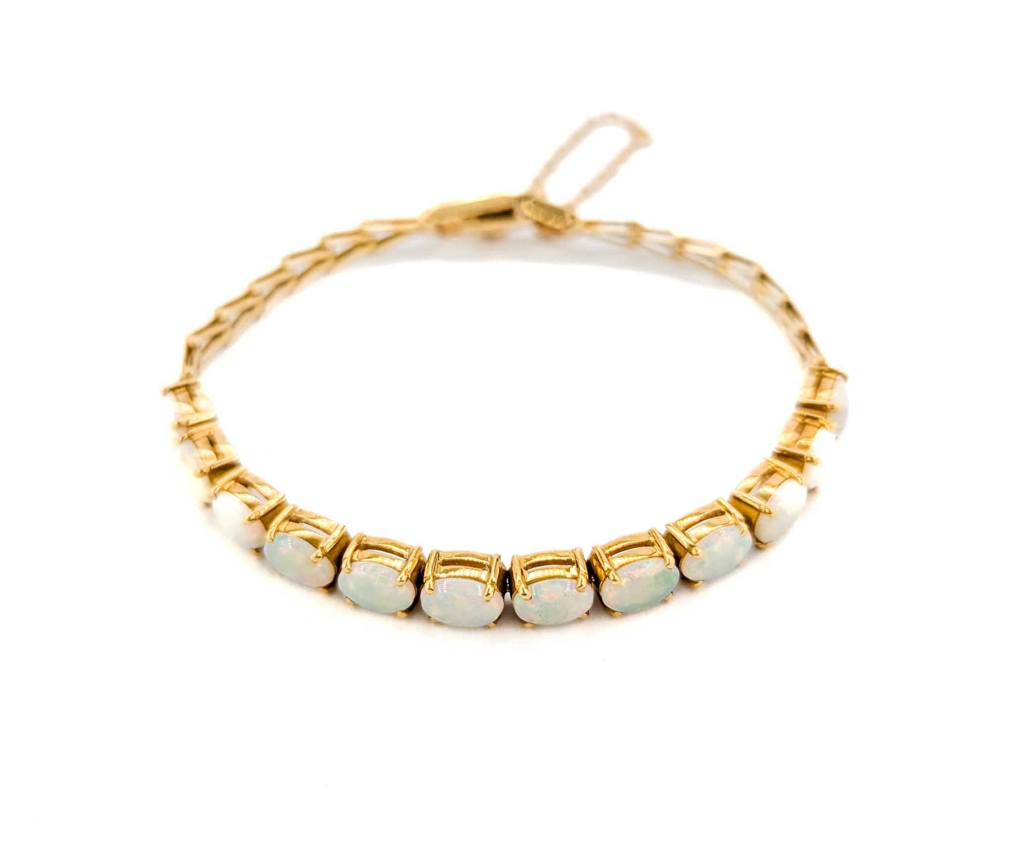 Australisches Armband aus 18 Karat Gold mit geflammtem Opal-Cabochon 3