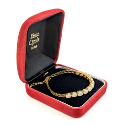 Australisches Armband aus 18 Karat Gold mit geflammtem Opal-Cabochon