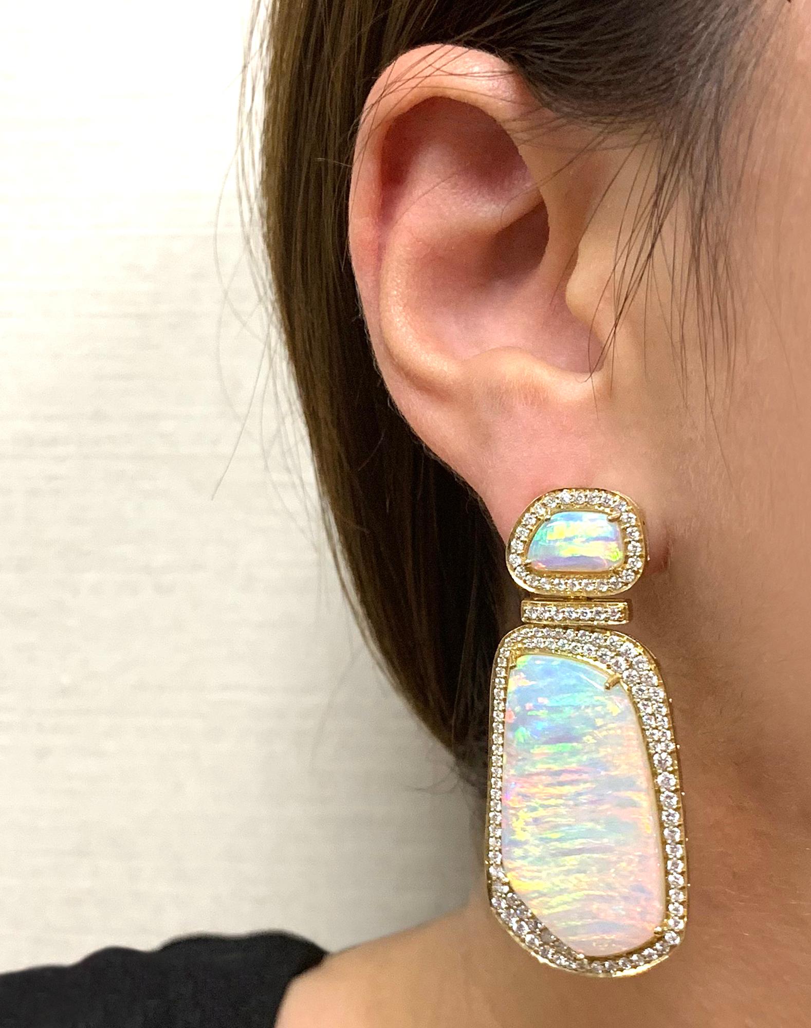 STYLE #: JE0218

Australian Free-form Opal Earrings in 18K Yellow Gold, from 'G-One' Collection

Approx. Wt: 29.90 Carats (Opal)

Diamonds: G-H / VS, Approx. Wt: 2.35 Carats