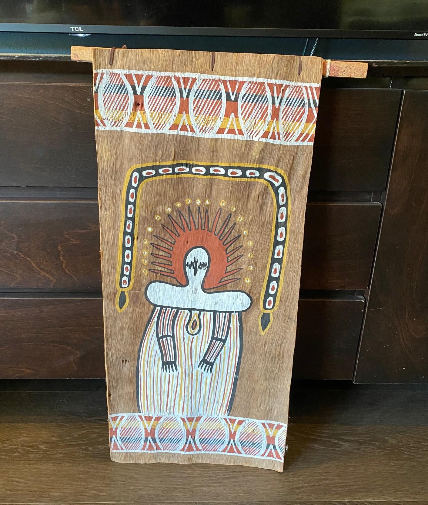 A wonderful, unique, and very engaging original indigenous Australian Aboriginal painting featuring a Wandjina figure.  The painting is made with natural earth pigments which are hand painted on natural wood bark.  The Wandjina (also written