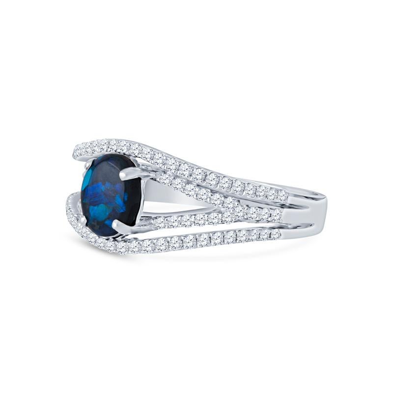 This exquisite ring features a mesmerizing 0.57ct oval blue opal paired with sparkling round diamonds totaling 0.43ctw, all elegantly set in luxurious 18 karat white gold. Perfect for women who appreciate natural beauty and fine craftsmanship, this