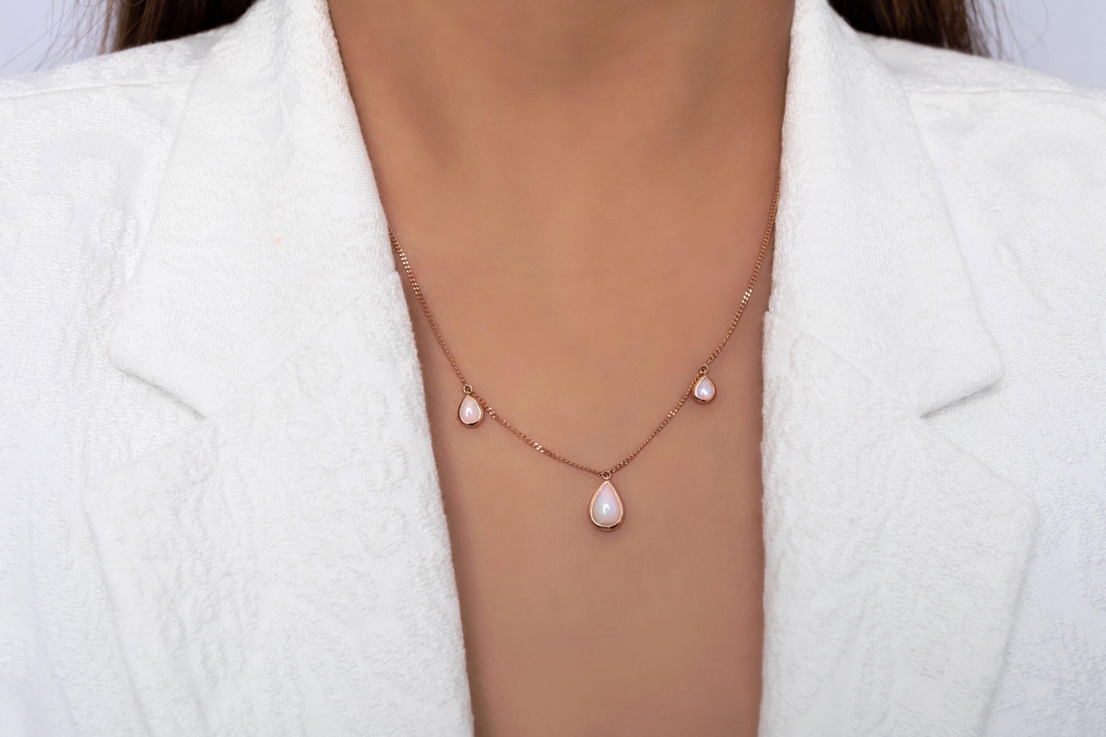 The dainty and becoming ‘Trinity’ necklace is for the stylish and classic woman featuring a trio of stunning boulder opals (1.83ct) ethically sourced from our Jundah-Opalville, Queensland mines. Set in a delicate 18K Rose Gold chain to let the