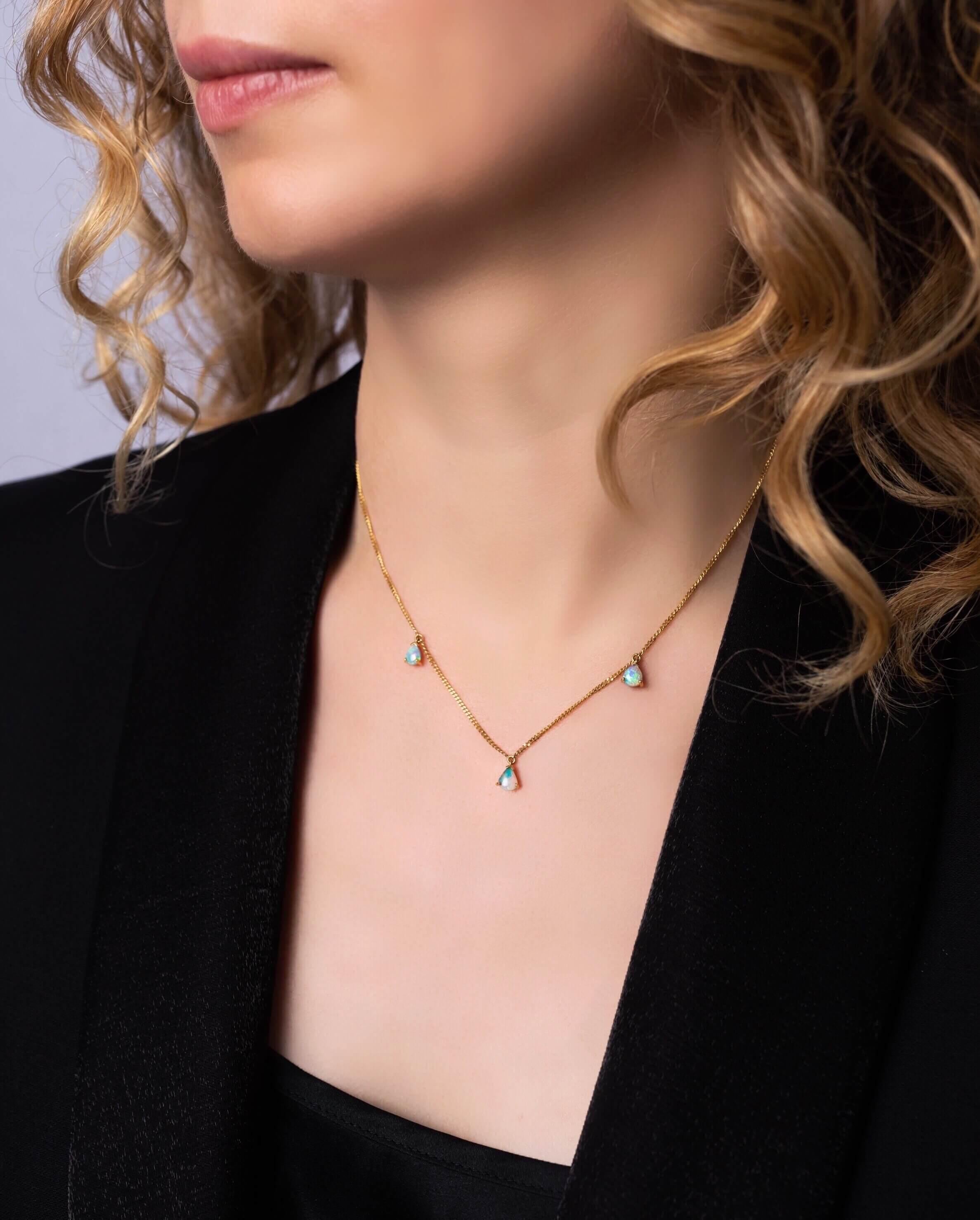 The dainty and becoming ‘Dewdrops’ necklace is for the stylish and classic woman featuring a trio of stunning boulder opals (0.77ct) ethically sourced from our Jundah-Opalville, Queensland mines. Set in a delicate 18K Yellow Gold chain to let the