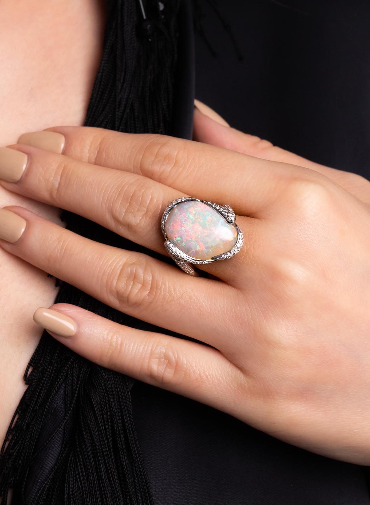 “Queen of Jundah” reigns with her majestic boulder opal (11.07ct) and brilliant-cut diamonds presented in an elegant 18K white gold setting. This precious opal from our mines in Jundah-Opalville displays a pinpoint pattern colour-play that is