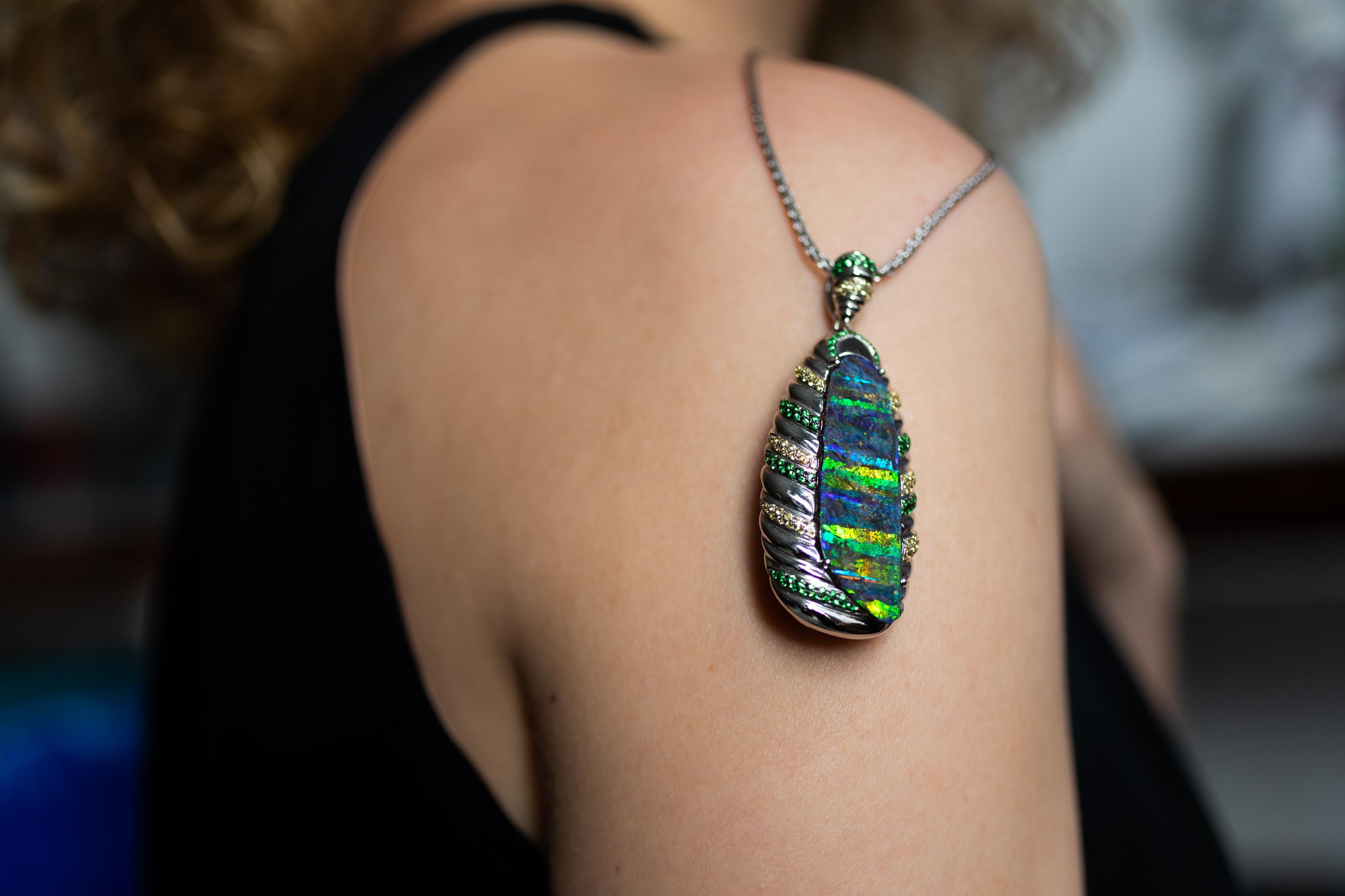 “Reef Cocoon” opal pendant celebrates the beauty of Australia’s Great Barrier Reef. The eye-catching 27.99 carat boulder opal from Winton is set against diamonds, tsavorites, yellow sapphires and 18K gold. Inspired by the secret nightlife on the