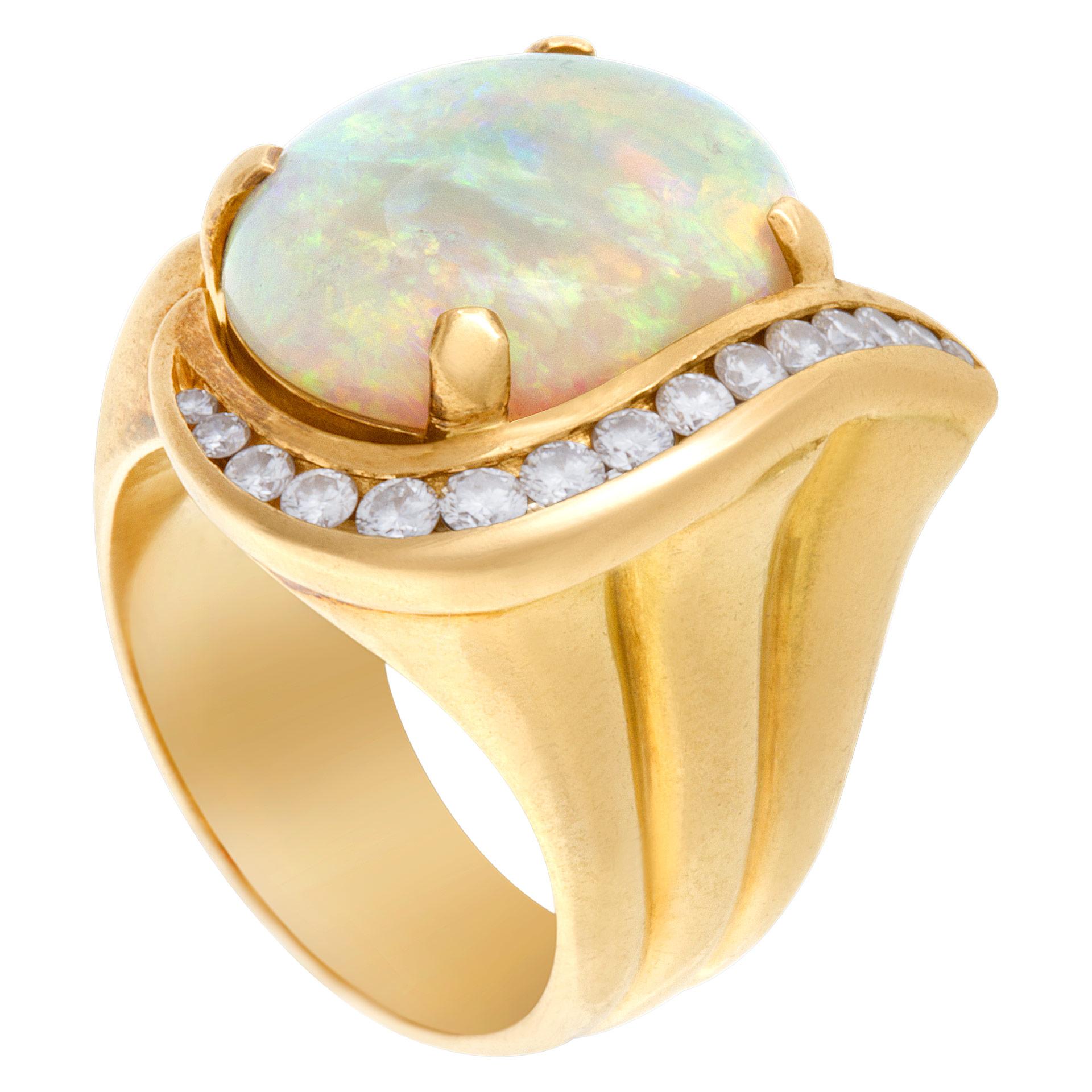 Australian opal and Diamond ring in 18k (0.50ct in diamond accents) Width- 19.5mm, Size: 6.75.  This Diamond ring is currently size 6.75 and some items can be sized up or down, please ask! It weighs 11.6 pennyweights and is 18k Yellow Gold.
