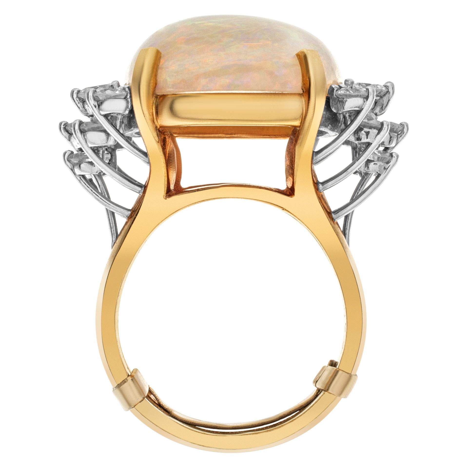 ESTIMATED RETAIL: $6,300 YOUR PRICE: $5,400 - Australian opal and diamond ring set in 18k white and yellow gold with an approximate 25 carat opal accented with approximately 2 carats in diamonds. Diamonds estimate (G color, VS clarity). GAL