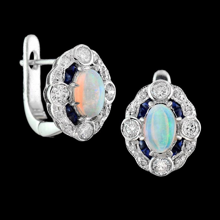 The earring was made in 18K White Gold, set with Australian Opal 0.60 Carat and French cut Blue Sapphire from Thailand 0.55 Carat.  The Diamond quality is H color SI clarity weight 0.43 Carat.