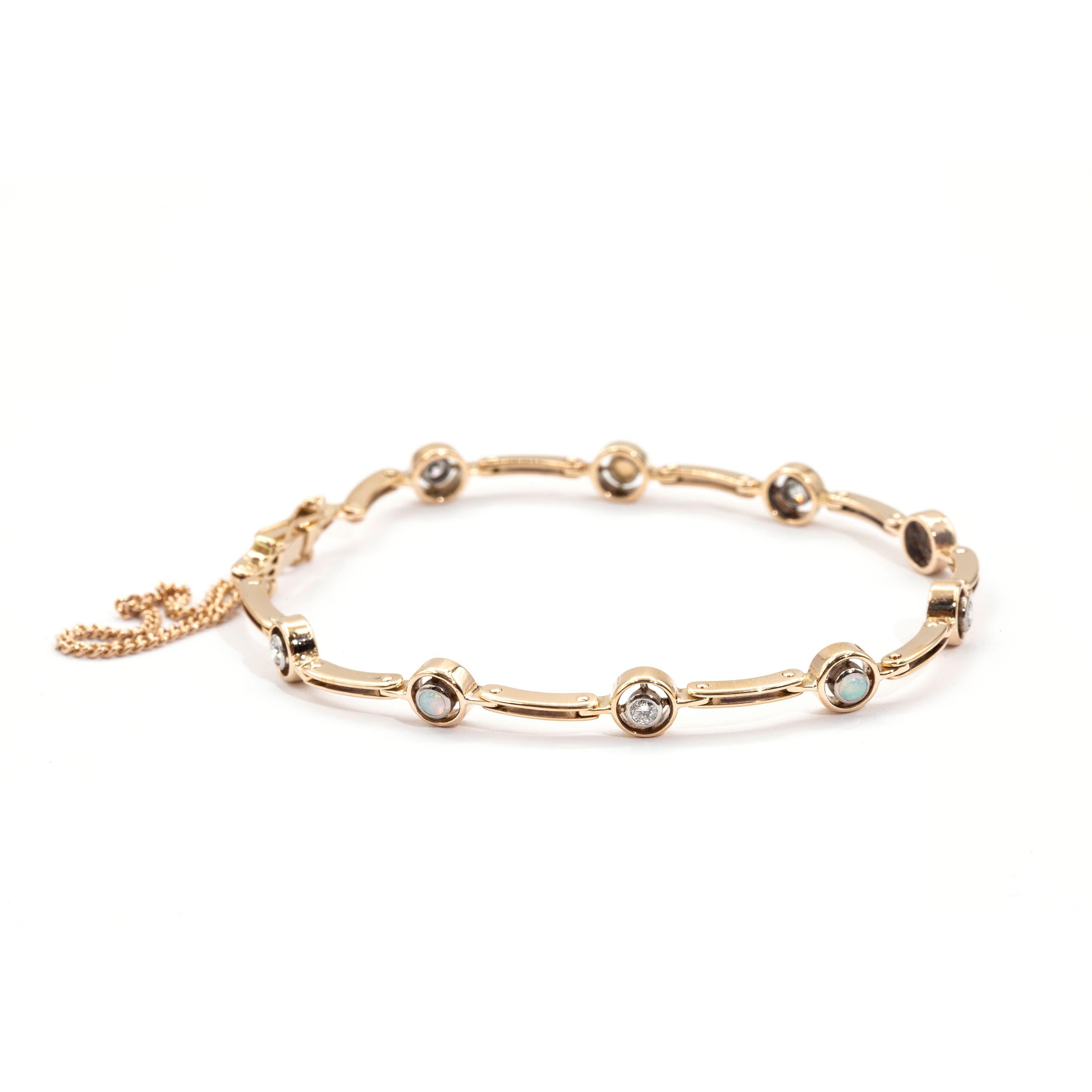 Carefully crafted in 9 carat yellow gold is this charming vintage bracelet featuring four round Australian opal cabochons and five round diamonds, all in white gold settings.  We have named this vintage splendour the Bethany Bracelet.  The Bethany