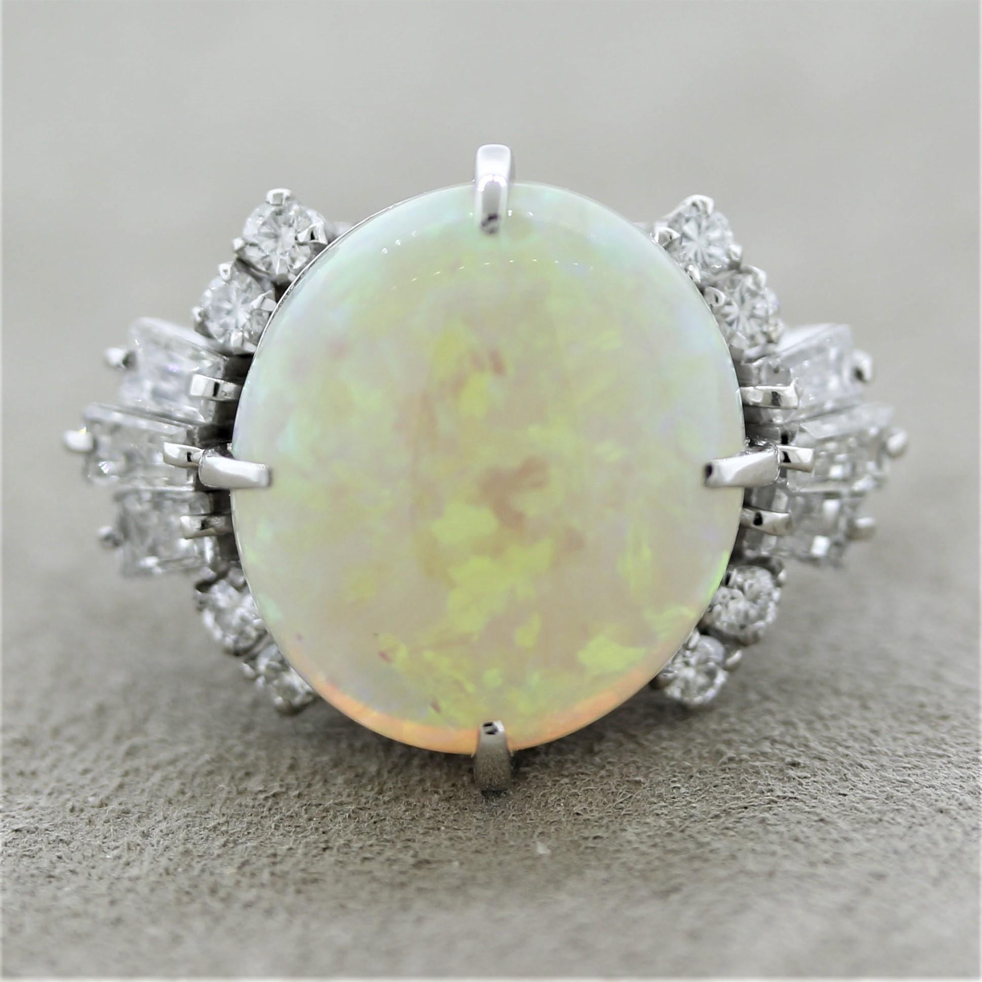 A fine Australian opal, most likely from the Lightning Ridge area, takes center state of this platinum made ring. It weighs 8.27 carats and has great play of color as flashes of green, blue, yellow, and orange dance across the stone. It is